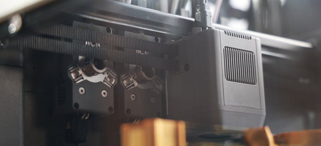 Closeup of Creator 5 Pro changing toolheads during a 3d print