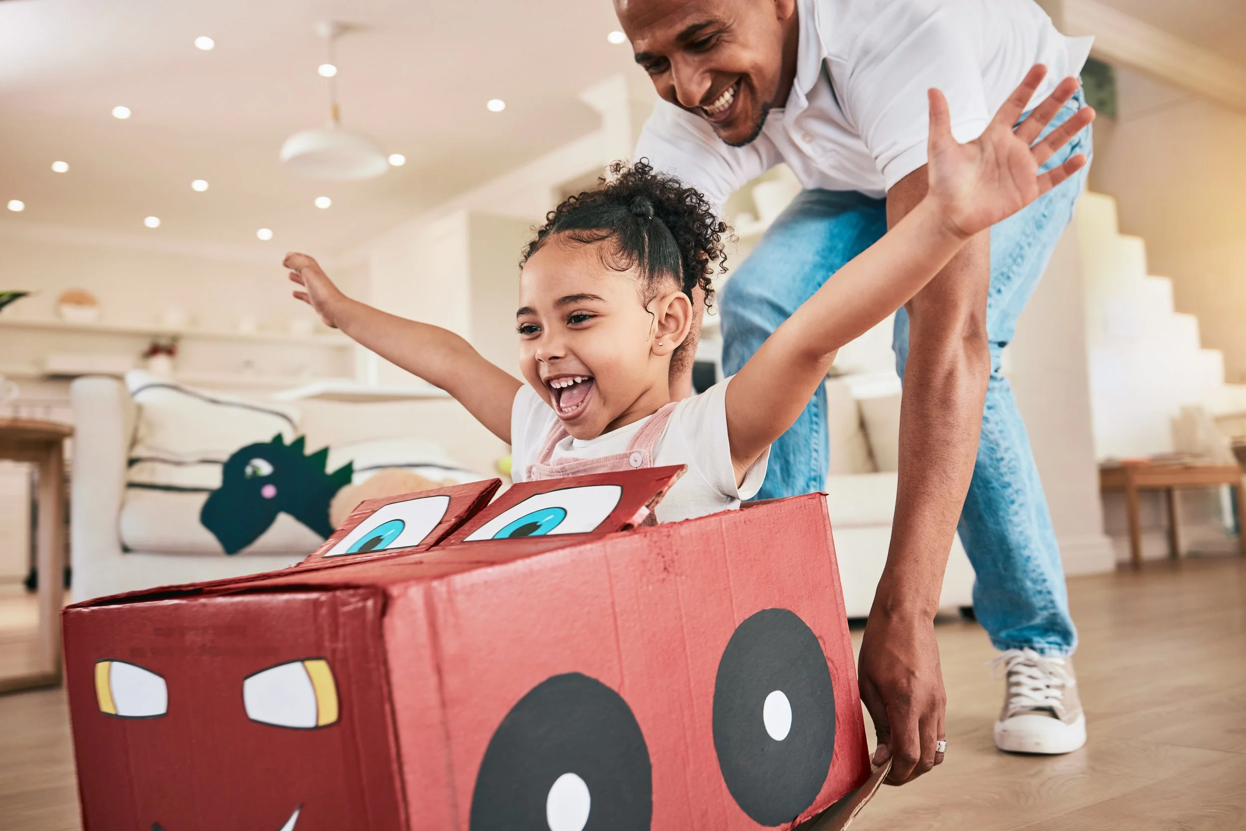 Granite Insurance Services_Father and Daughter Playing Car inside Home_594901875.jpeg