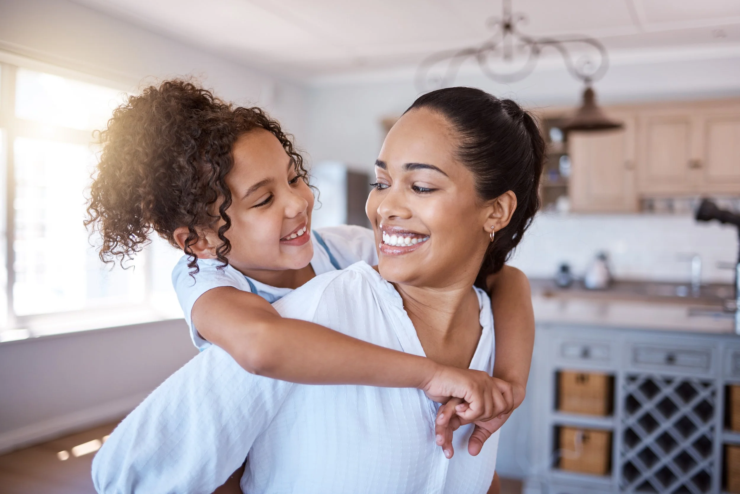 mother and daughter in home kitchen