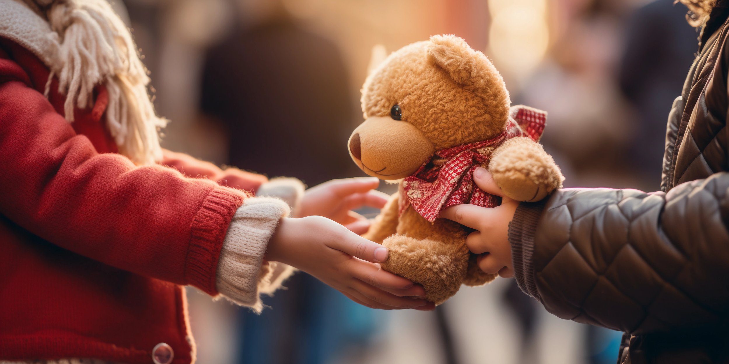 Children Giving Teddy Bear_626810814.jpeg