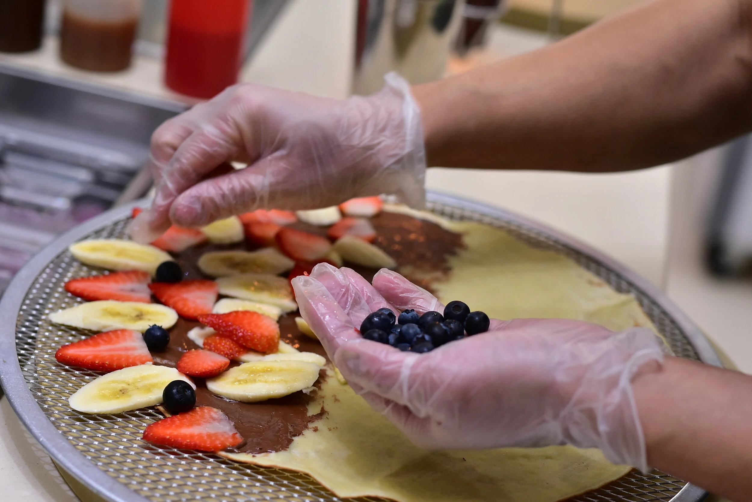 Adding fruit to a crepe