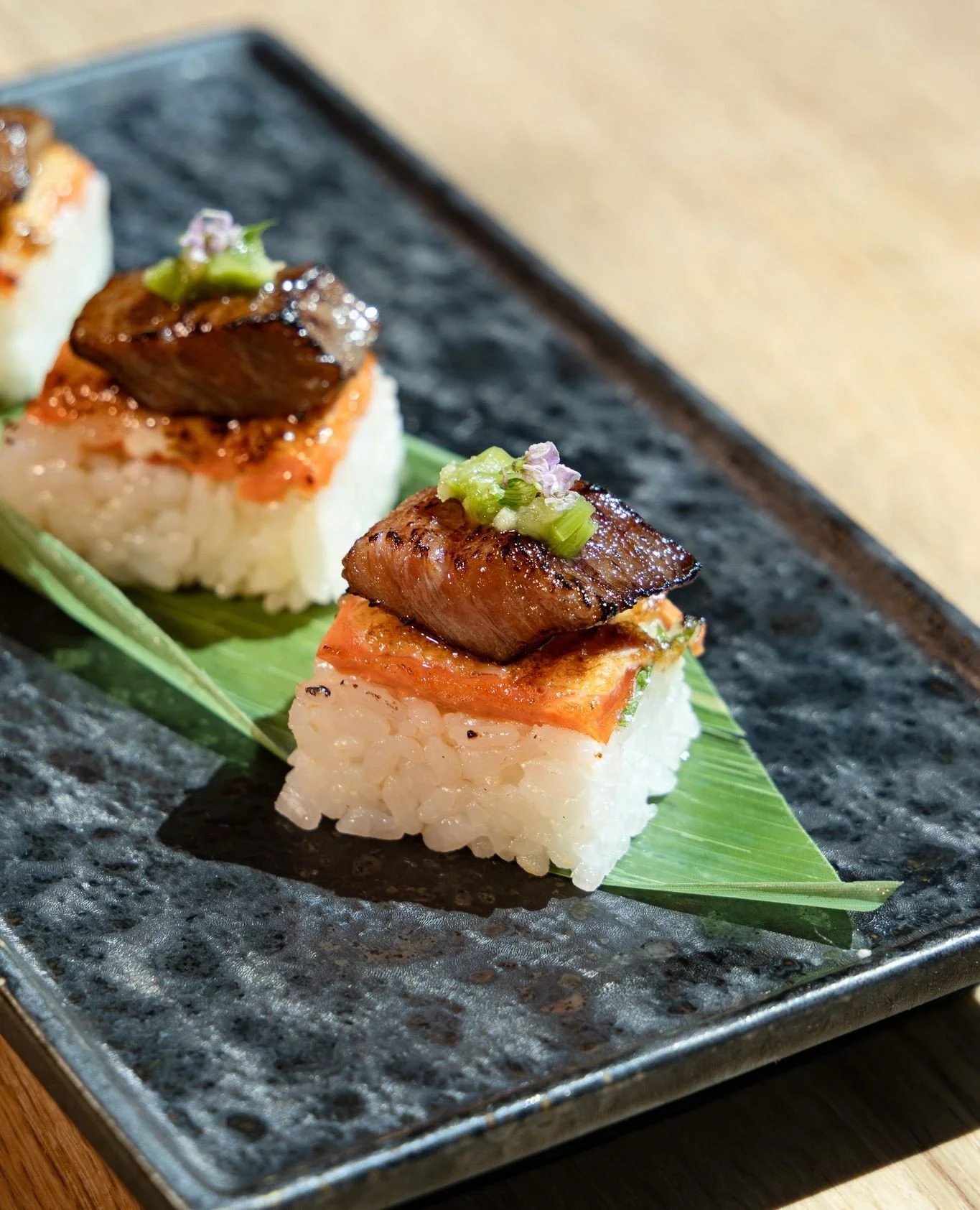 Pressed to perfection, then charcoal flame torched.⁠
⁠
Our salmon wagyu oshi is a staple at Hello Nori Signature and a daily special at our @hellonori's when you&rsquo;re lucky enough to catch it!⁠
⁠
.⁠
.⁠
.⁠
.⁠
.⁠
#hellonori #aburioshi #japanesewagy