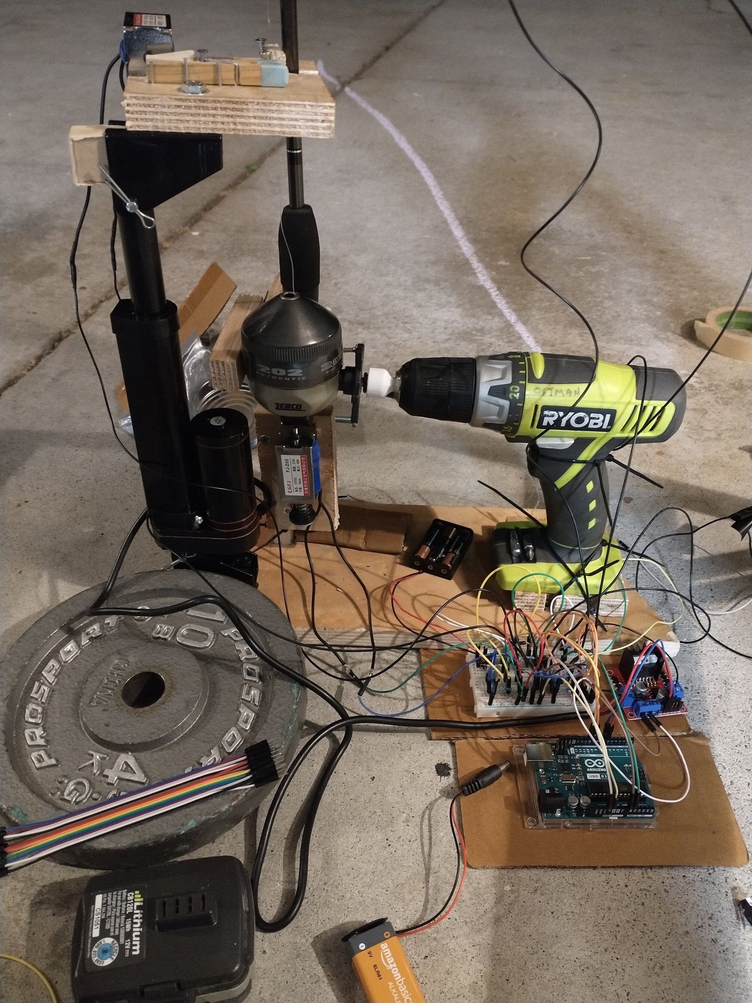 A semi-automated candy distribution system I built to deliver candy to trick or treaters. A fishing reel is used to descend the candy to the end of the driveway via a zipline after the user interrupts the path of a laser aiming back at the device. On