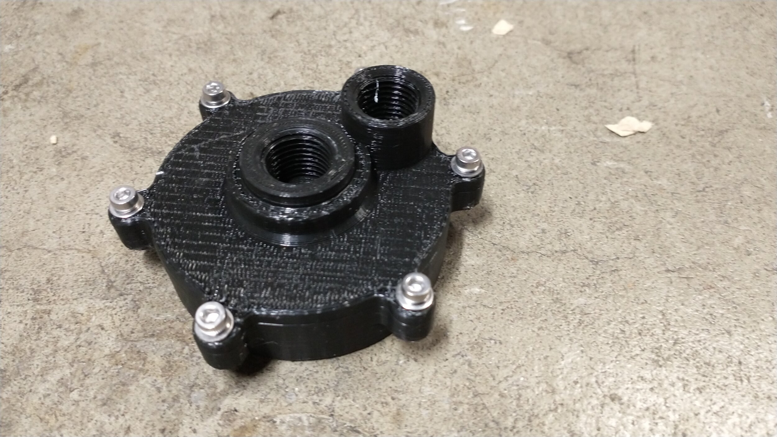 A 3D printed injector from the top, with ports for air and water to test the aerosolization of the liquid and the mixture of the two fluids. For more details, click the image.