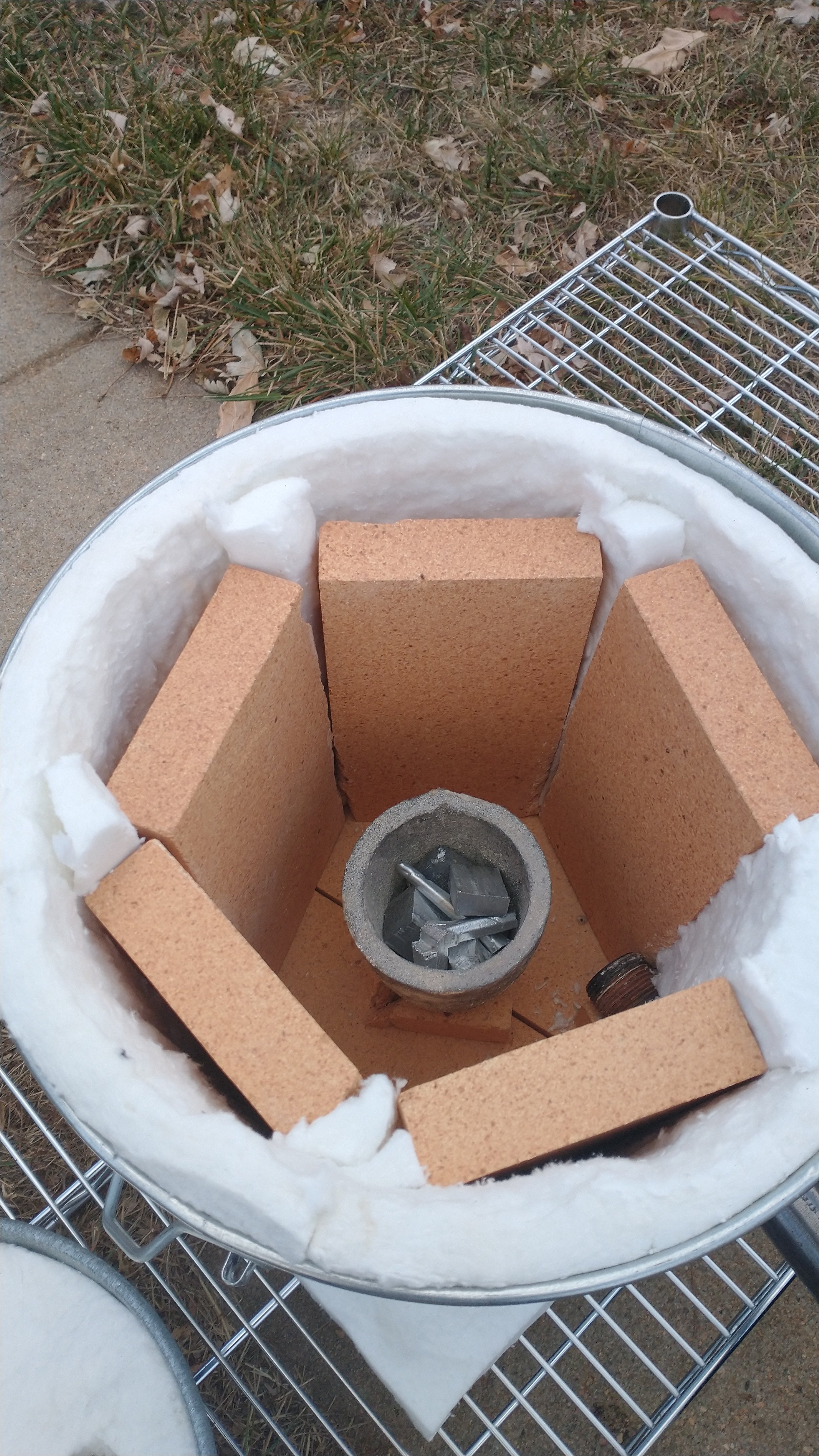 A close up of the insulation and crucible inside the bucket.