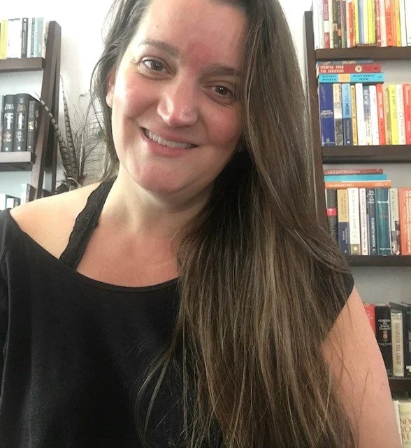 Picture of a woman with long hair in a black shirt