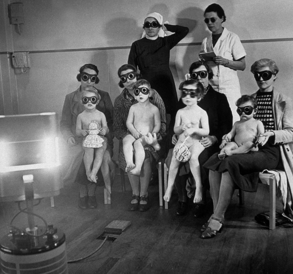  Children receiving ray treatment at the child welfare centre in Harrow Road, West London. 1938.. 