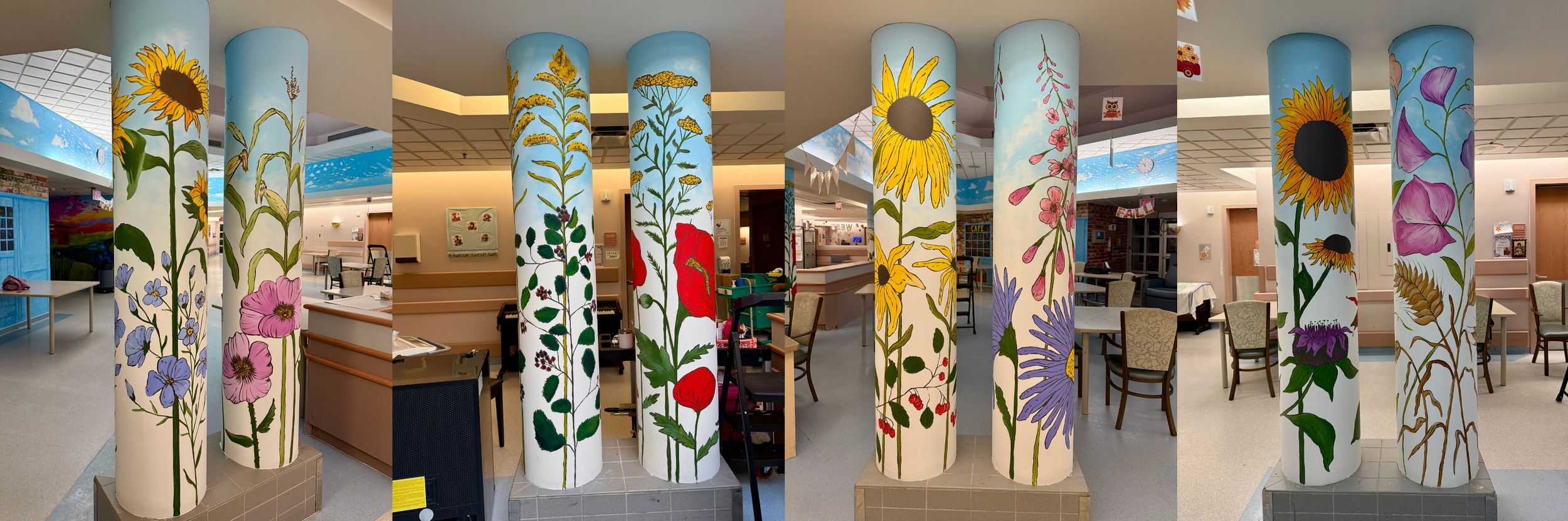 Colorful painted columns with floral designs inside a building, featuring murals of various flowers and plants.