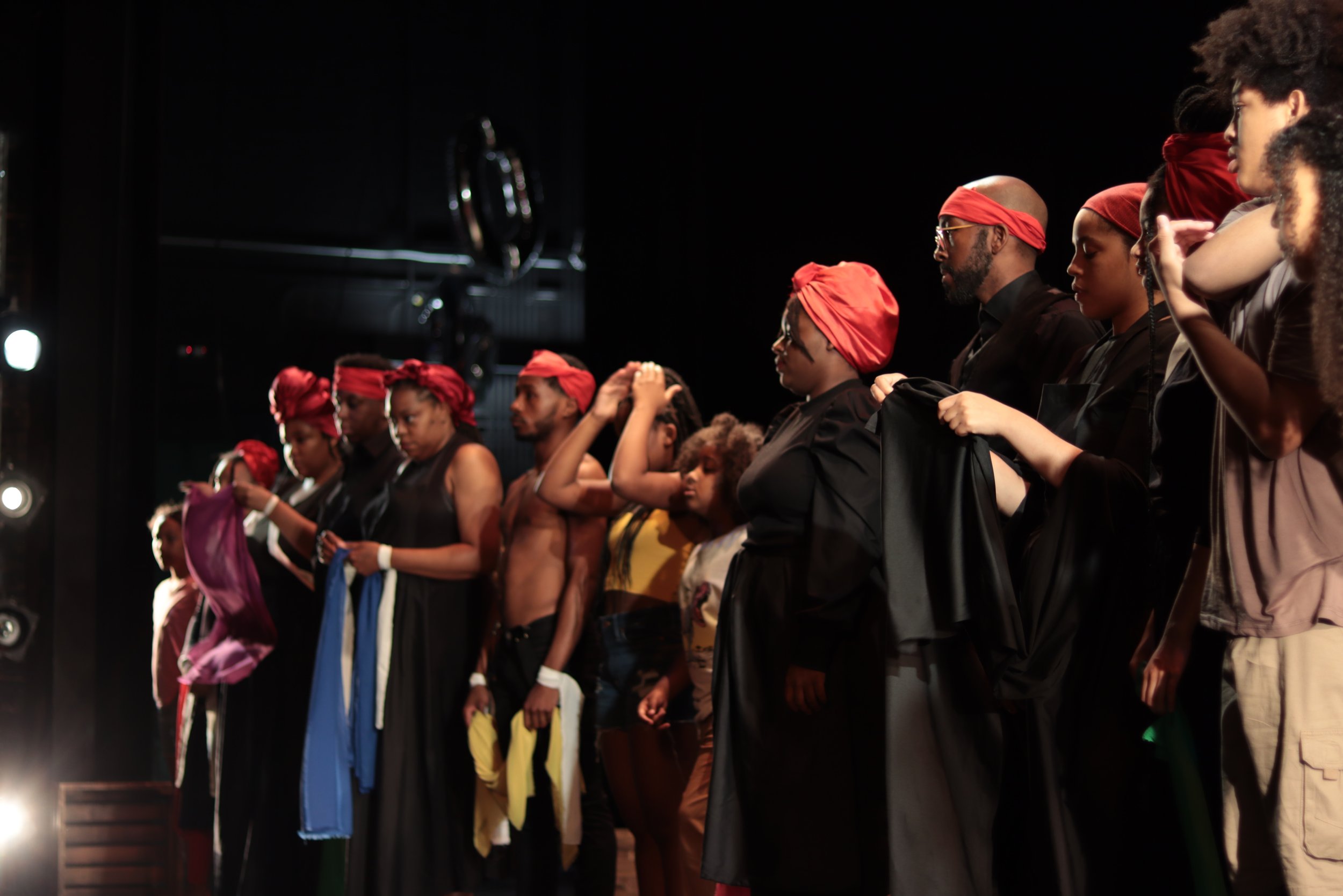 Photo by Kian Arin
Aurway Artists standing in a line downstage at Arts High School in Newark, NJ
