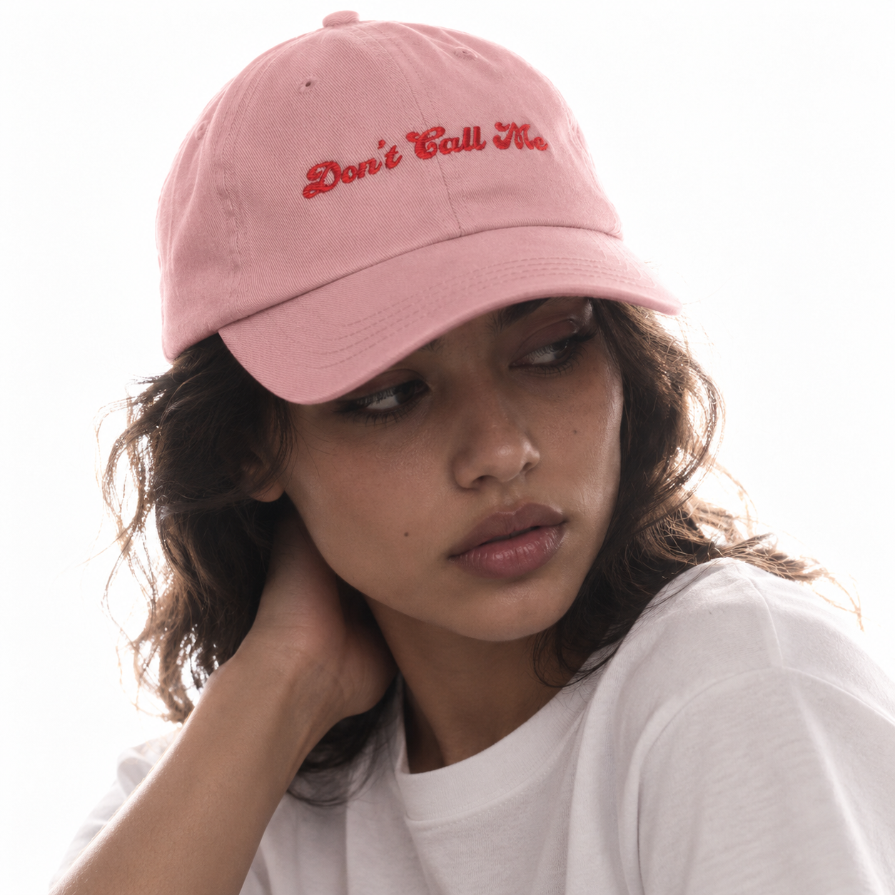 On model Pink Crasch Out Cassie dad hat embroidered with the words Don't Call Me in red script