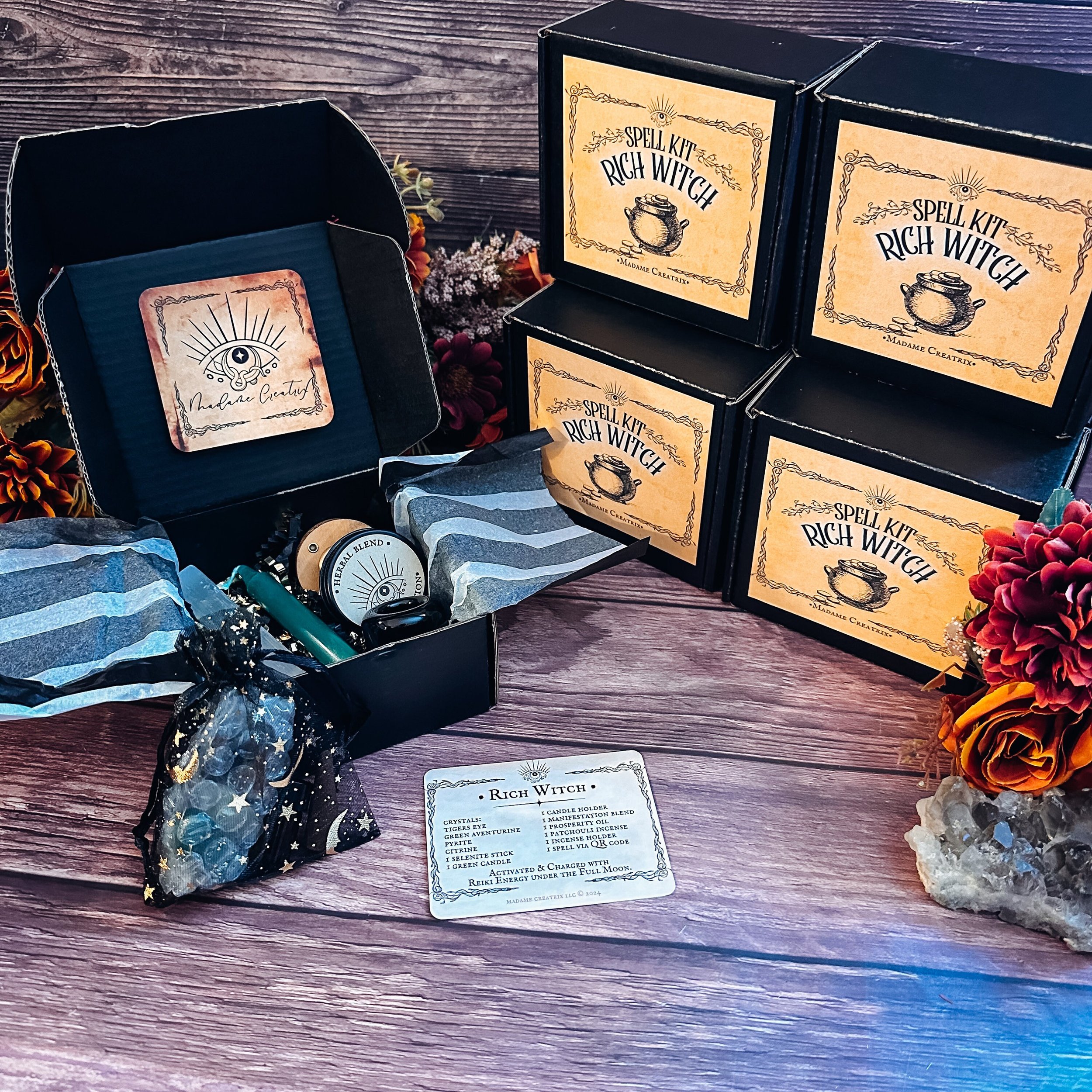 Rich Witch Spell Kit contents: crystals, green candle, herbal blend, oil, and incense displayed beautifully.