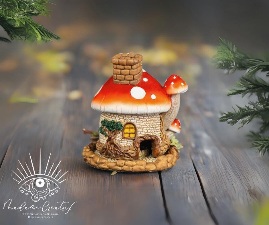 Decorative mushroom house incense burner styled in a cozy living room setup.