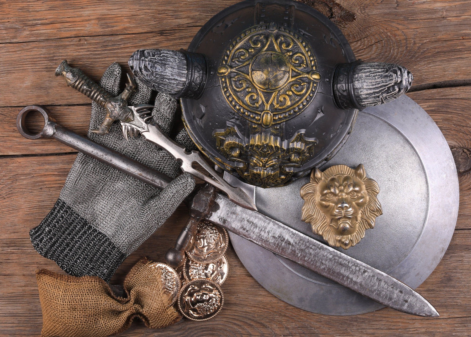 Symbolic medieval armor, chain mail, sword and shield for protection, offense and defense.