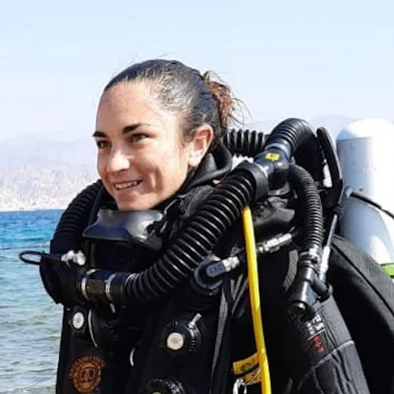 Coral acclimation and migration to mesophotic depths