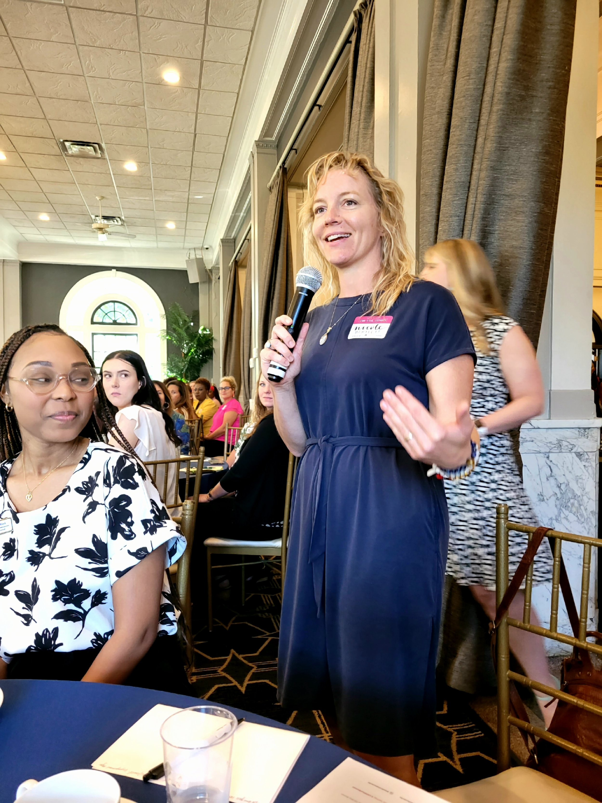 Action shot of Nicole while publically speaking