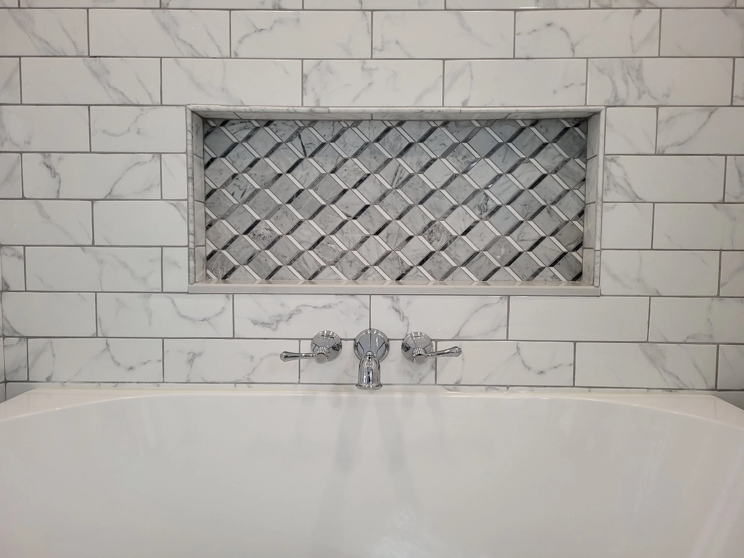 Detailed shower niche above the freestanding tub