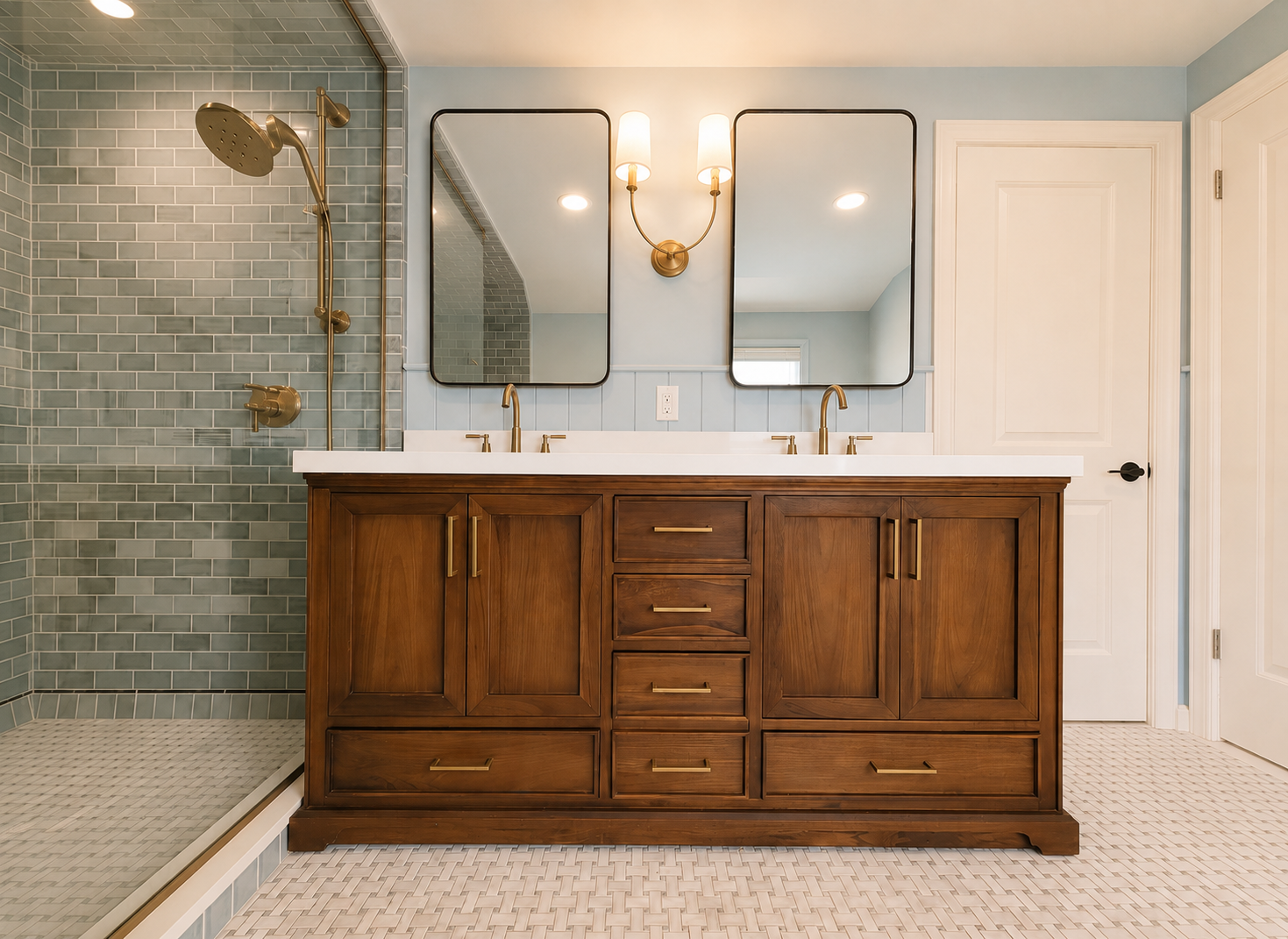 A dark wooden vanity with modern brass finishes.