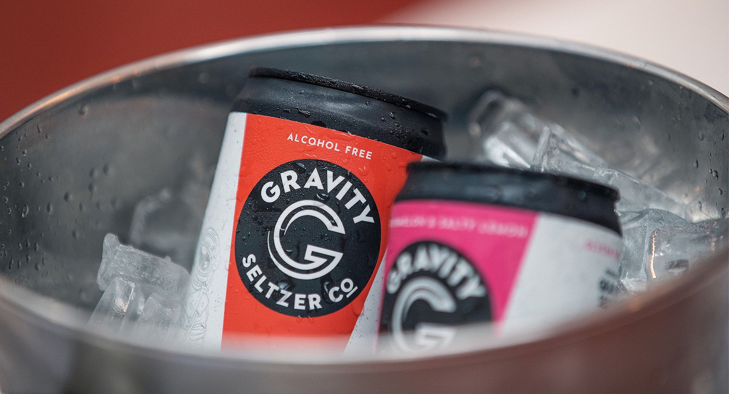 Cans of Gravity Seltzer Co. alcohol-free drink in a metal ice bucket.