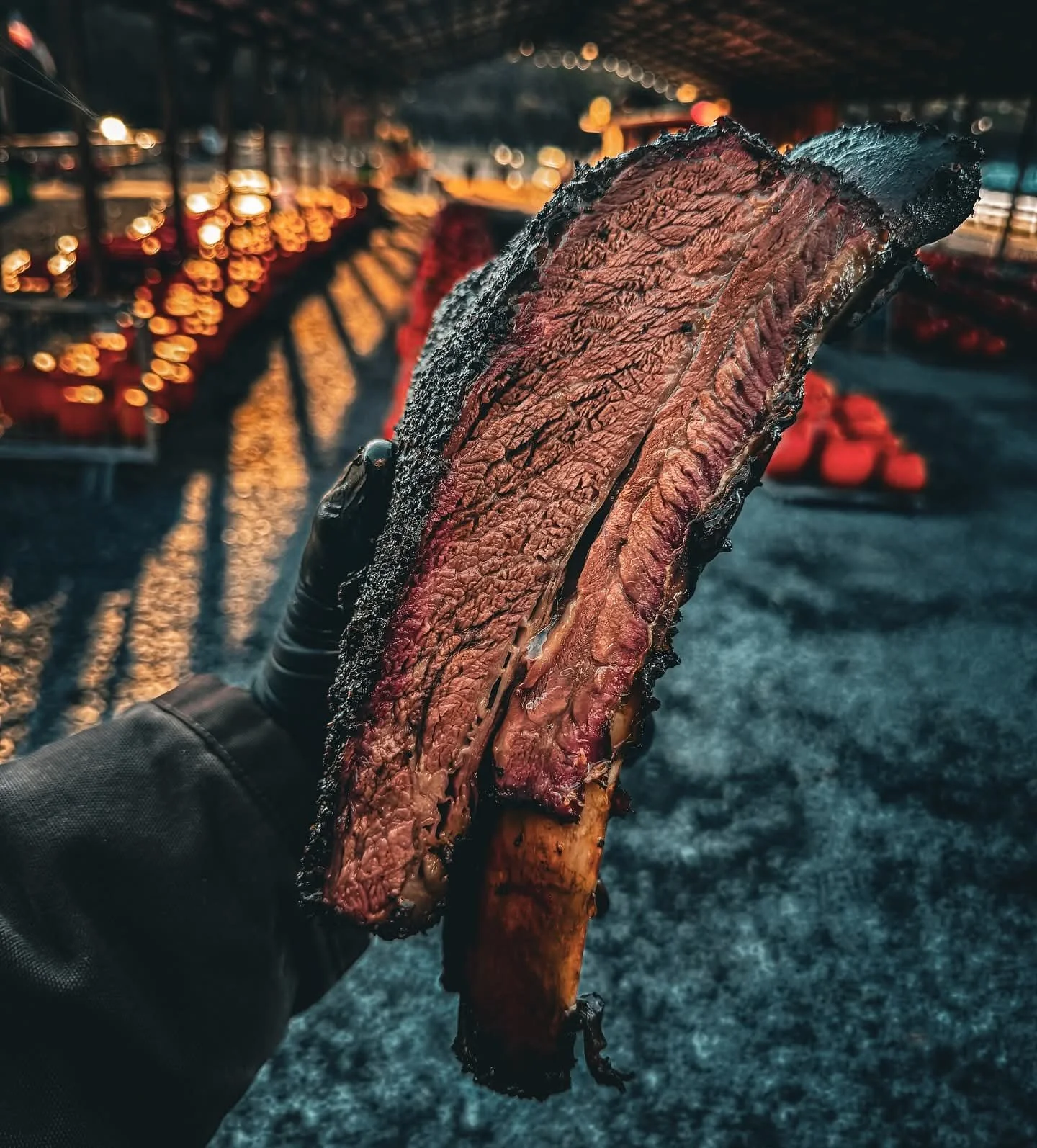 Texas-style slow-smoked beef short ribs with rich smoky bark, prepared by the pitmasters at Moo Moo Smokehouse & Grill in Auckland.