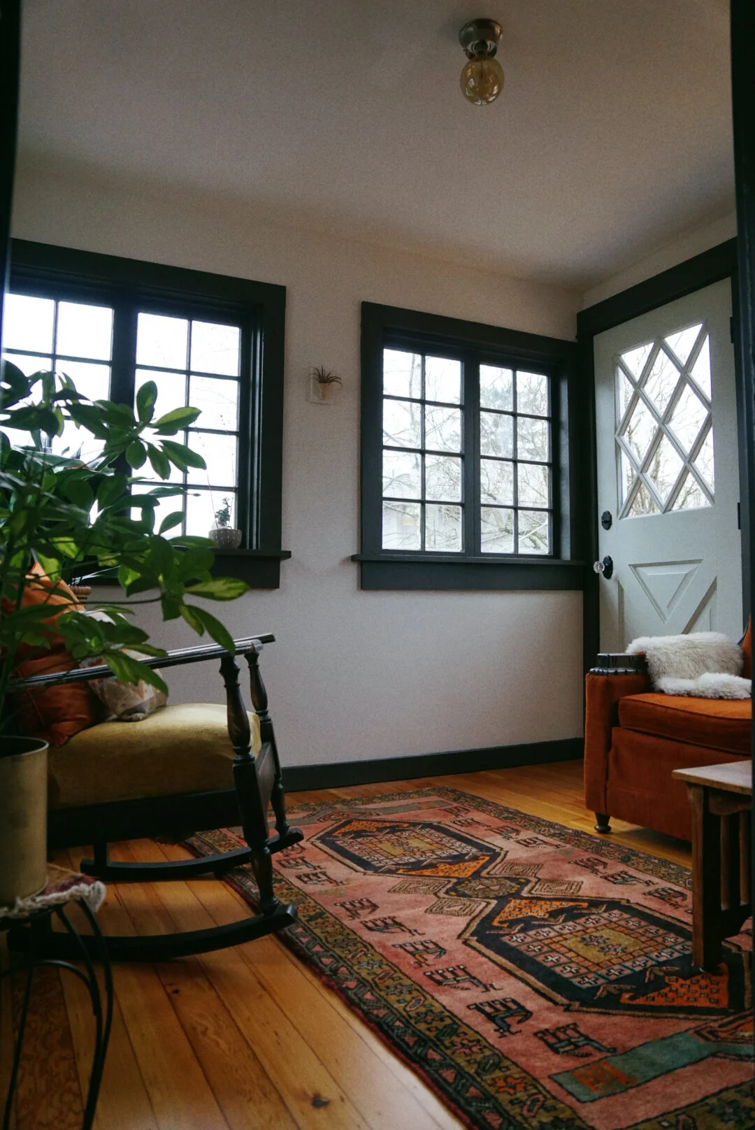 fir floors were salvaged & refinished, door is from the rebuilding center & paint is sherwin williams. all furniture & decor are second hand, vintage finds!