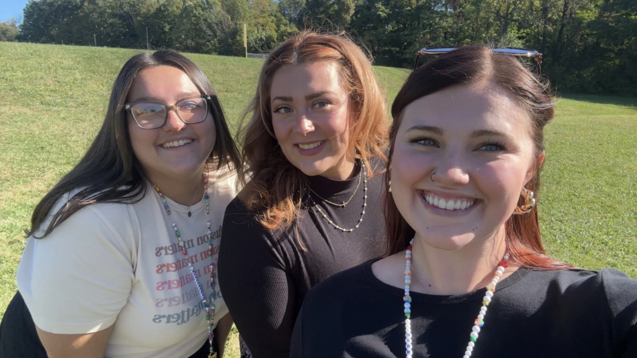 This is my co-teacher, Jenna, the 7th-grade math teacher, Jade, and I on school-picture day!