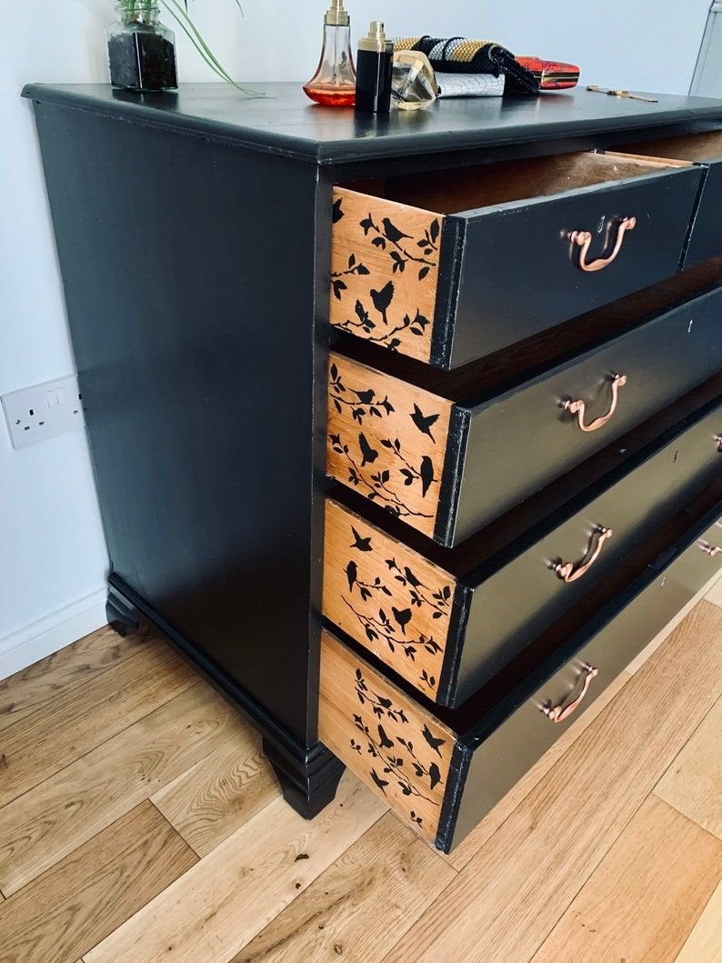Beautiful black chest of drawers with stencilled birds and metallic copper handles.jpg