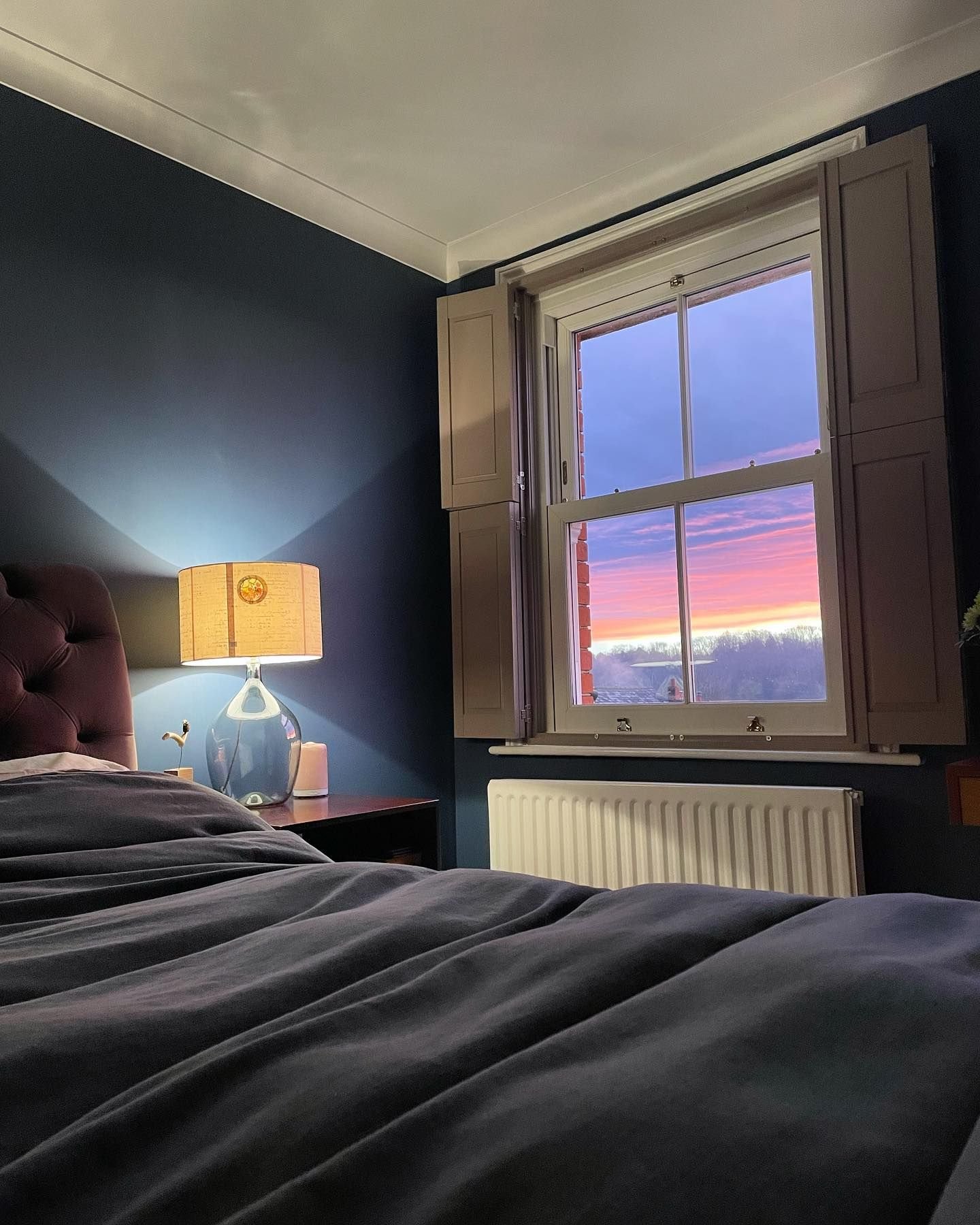 This bedroom in @littlegreenepaintcompany Hicks Blue is so cosy and welcoming. Many people shy away from darker colours in bedrooms, but not only is it really warm when ambiently lit, but it really frames a view.