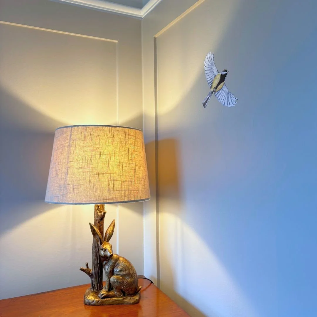 Adding painted wall panelling to one or more areas in a small space makes such a massive difference. By layering this with warm lighting, whimsical wall art and antique furniture, this little nursery space went from an uninviting box room to a welcom