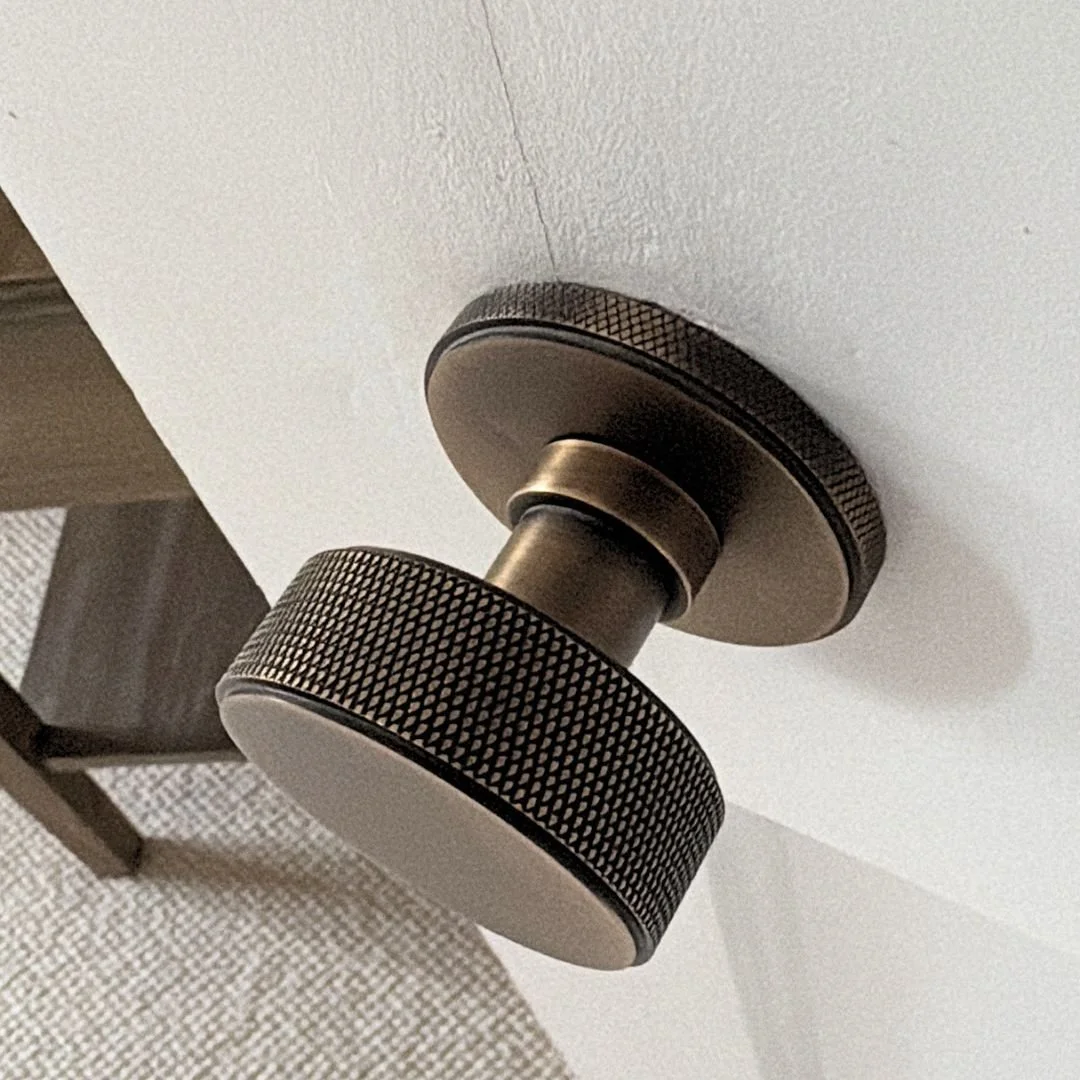 Door handles are one of those details you interact with every single day, so they should feel as good as they look.

We always specify handles with a satisfying weight, a smooth locking mechanism and a finish that coordinates properly with the latche