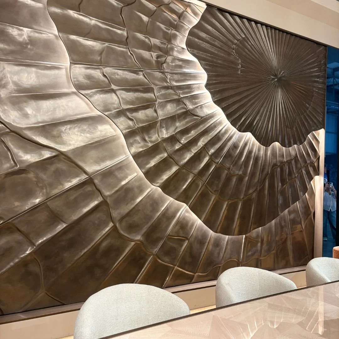 Luxury doesn&rsquo;t always need to come from adding more to a room. Sometimes the building itself can become the artwork.

Layered bronze wall panels like these, combined with carefully integrated lighting, bring depth, texture and changing reflecti