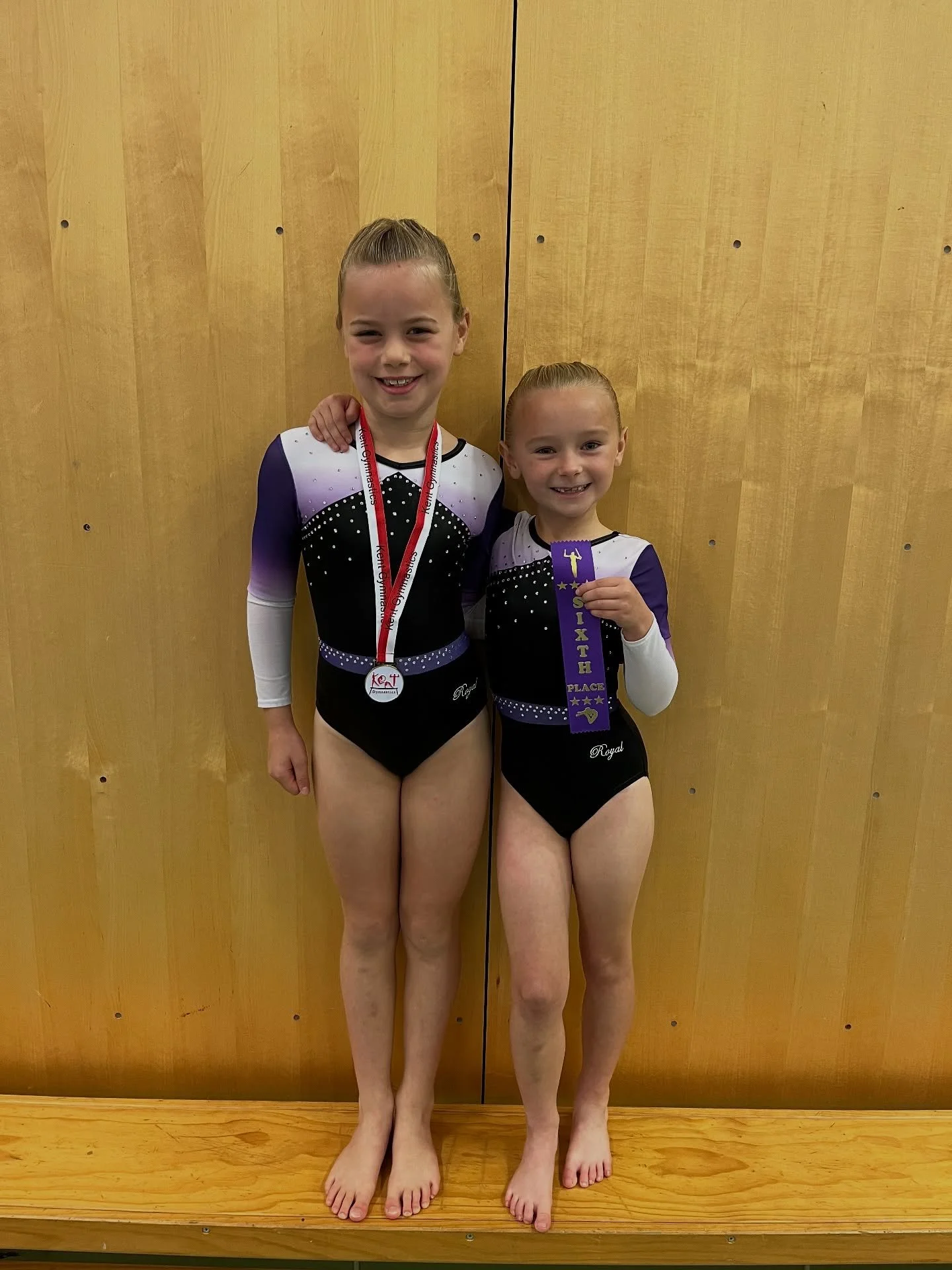 Round 2! Another great round! Yet again another first competition for one of our gymnasts💜

Charlotte- Kent champion🥇
Hallie- 6th Place ribbon