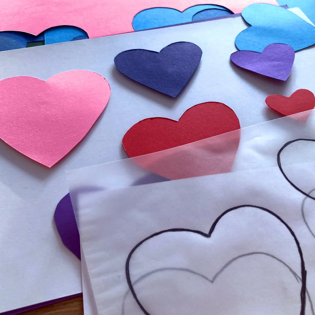 Cutting out the paper hearts.