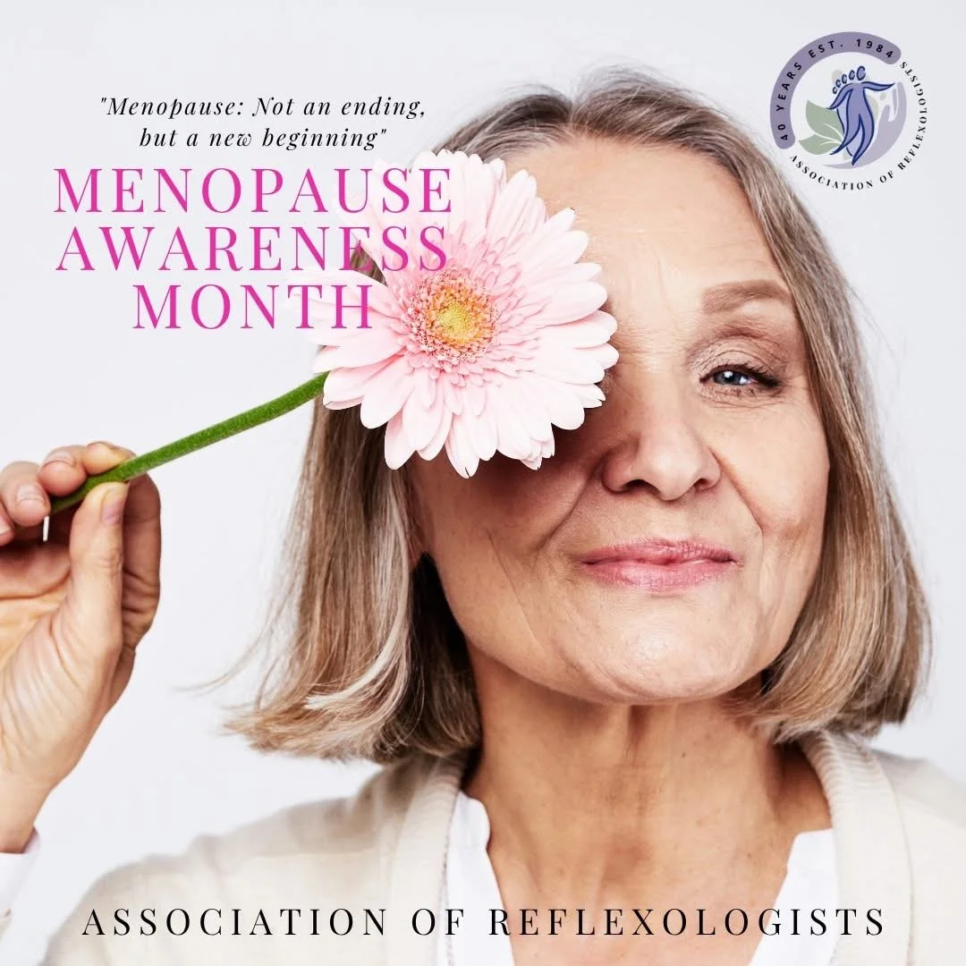 Middle age women holds pink flower to her eye, celebrating that there is life after menopause