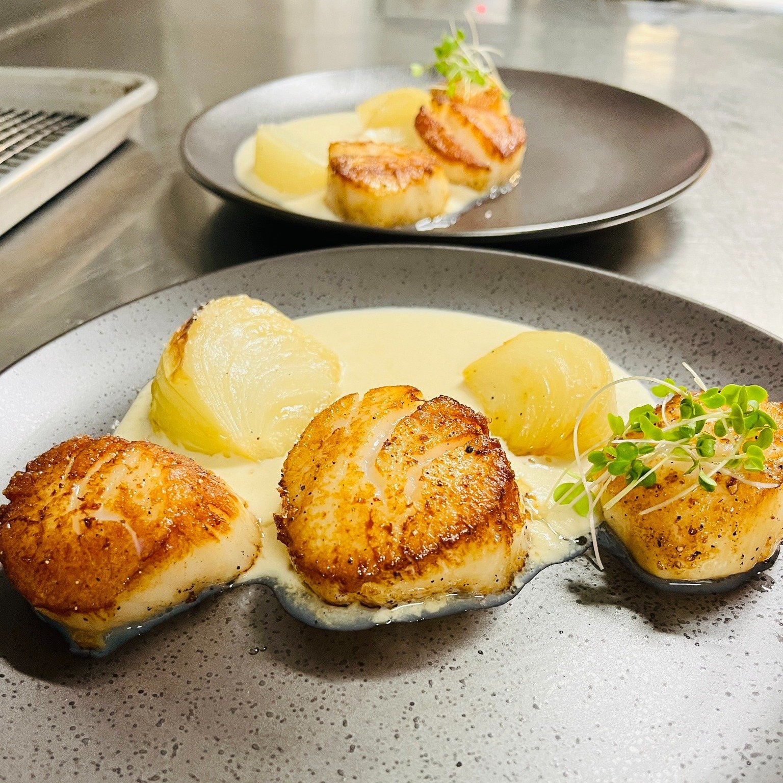 ✨Prepare to be delighted! ✨

This week our diver scallops are seared to golden perfection and served with a delicate onion soubise and roasted sweet onions. 

Each bite is a symphony of flavors that will transport you to a realm of gastronomic bliss.