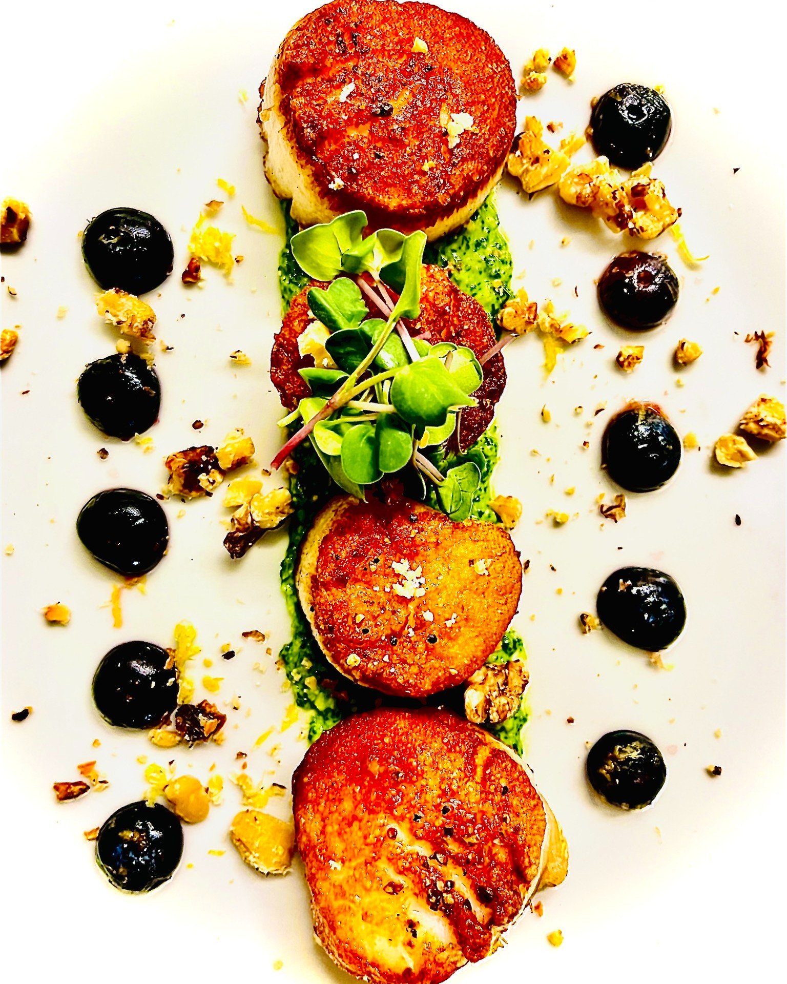 ✨ A Symphony of flavors ✨

Golden-crusted Sam Rust Seafood scallops&mdash;seared to perfection&mdash;meet the bold embrace of our arugula pesto, crafted with Copper Cricket Farm&rsquo;s bity arugula, Parmigiano Reggiano, extra virgin olive oil, pine-