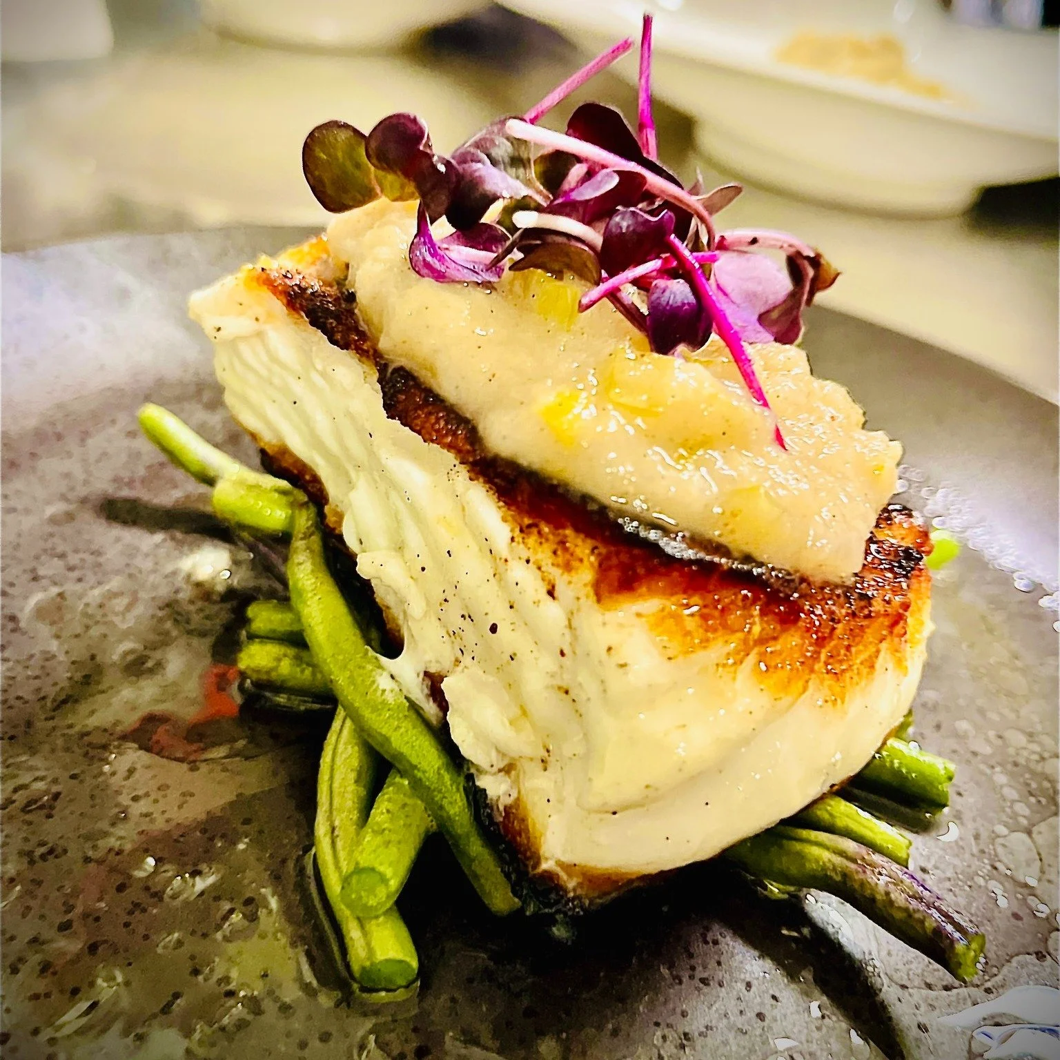 ✨ A dish that tastes like early autumn.

Our halibut fillet &mdash; fresh from Sam Rust Seafood &mdash; is perfectly seared, golden and crisp on the outside, tender and moist inside. It is served on a bed of Copper Cricket Farm&rsquo;s purple beans &