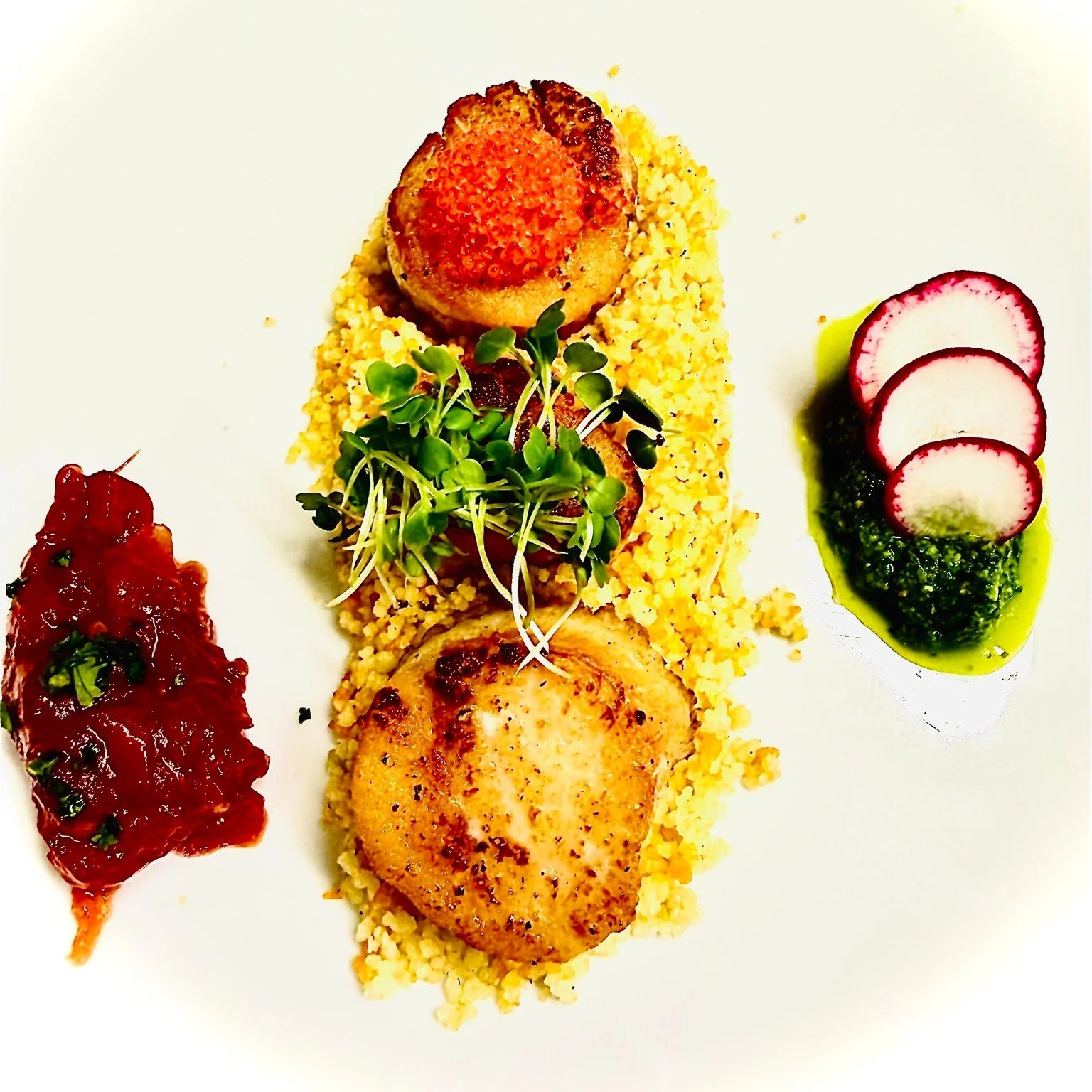 Scallops are back on the menu&hellip; and honestly, they&rsquo;re stealing the scene this week. 

Perfectly seared, they are served over couscous with house tomato marmalade, peppery arugula pesto topped with fresh radishes and finished with tobiko c