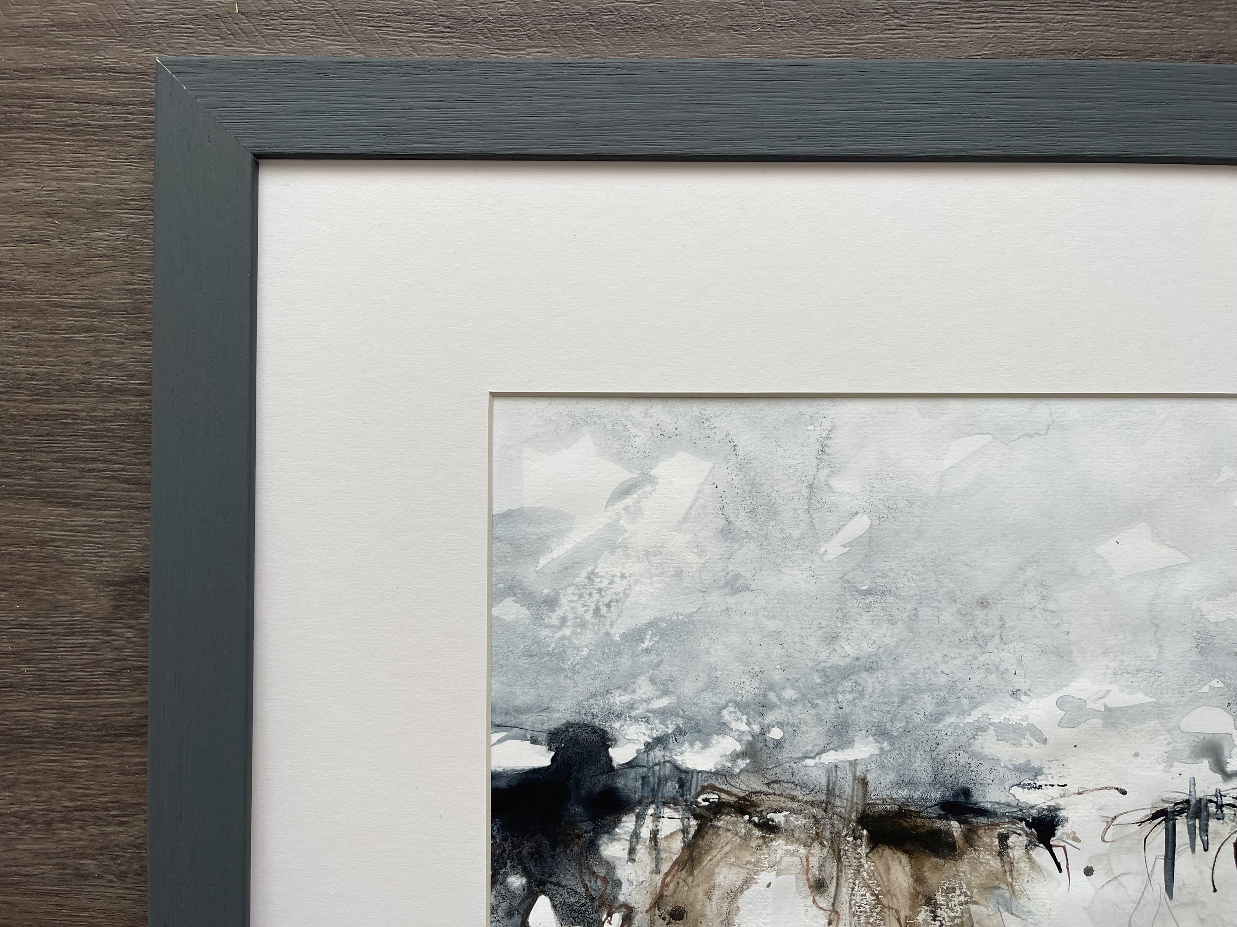Close up of the mount and frame of this semi-abstract seascape painting
