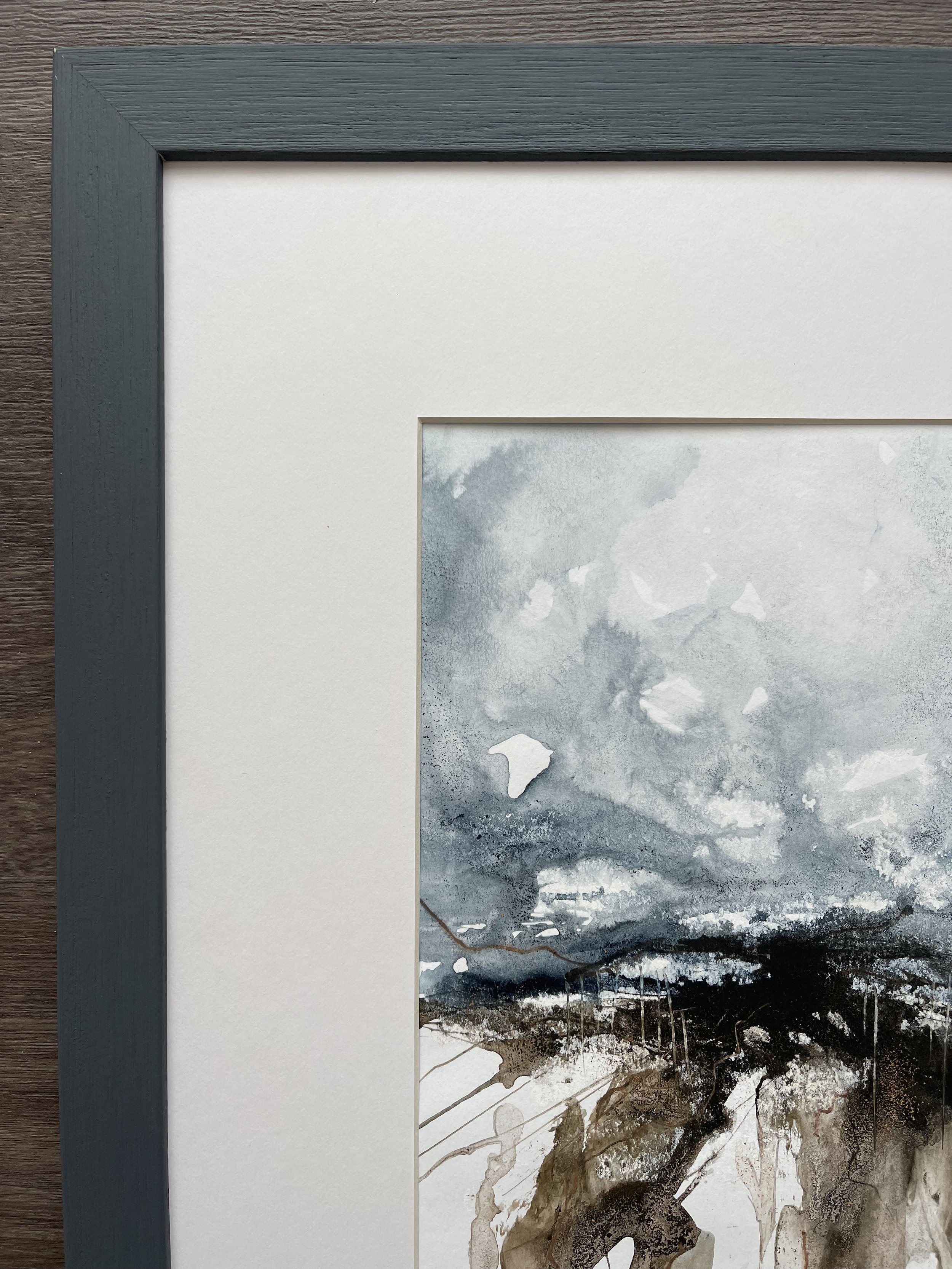 Close up of the frame and mount of this expressive watercolour and ink seascape inspired by the north Norfolk marshes and creeks