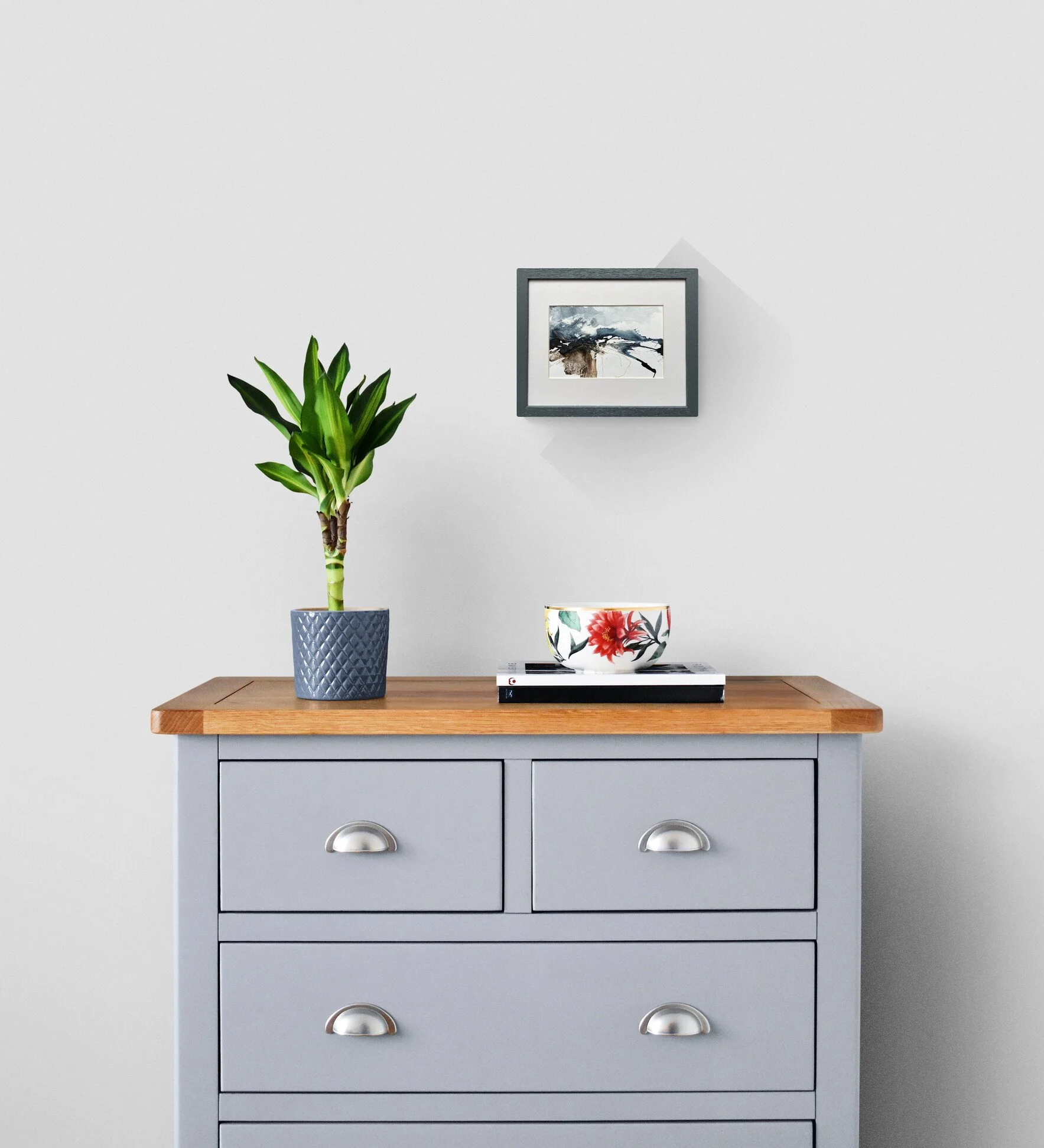 Abstract seascape painting displayed in a room setting