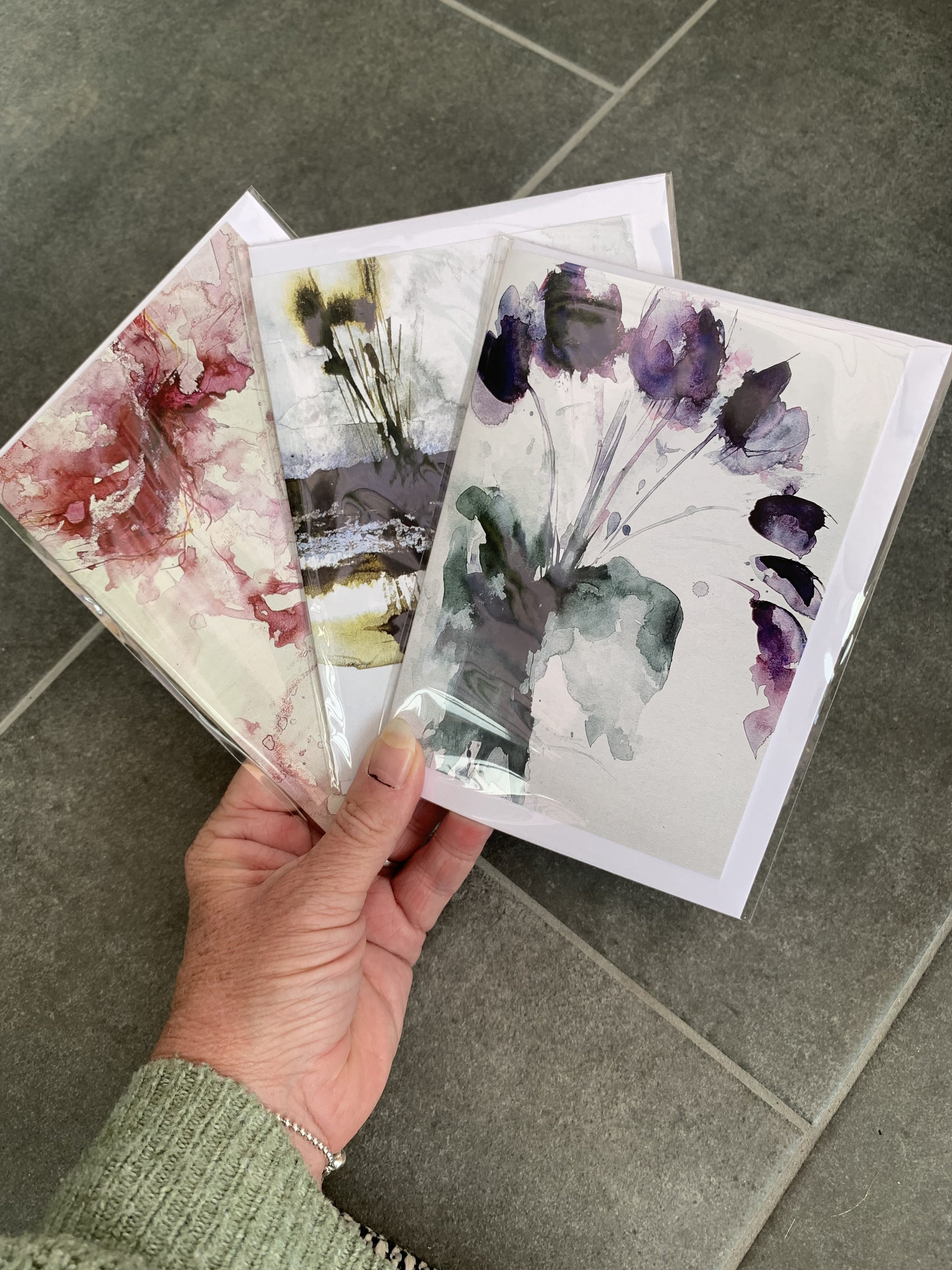 Three cards in a bundle