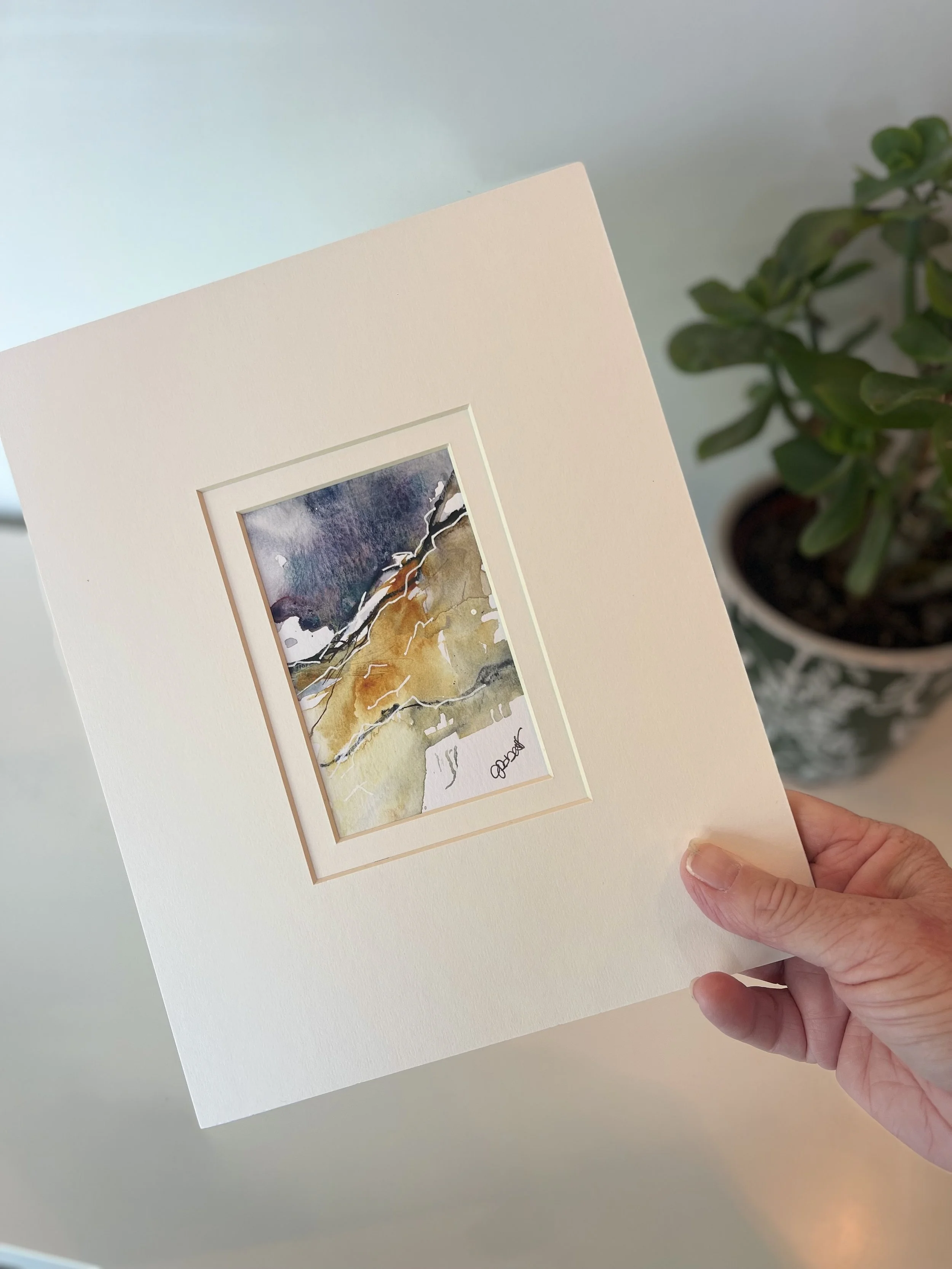 whisper-over-the-edge-painting-held-in-hand-size-reference.jpg