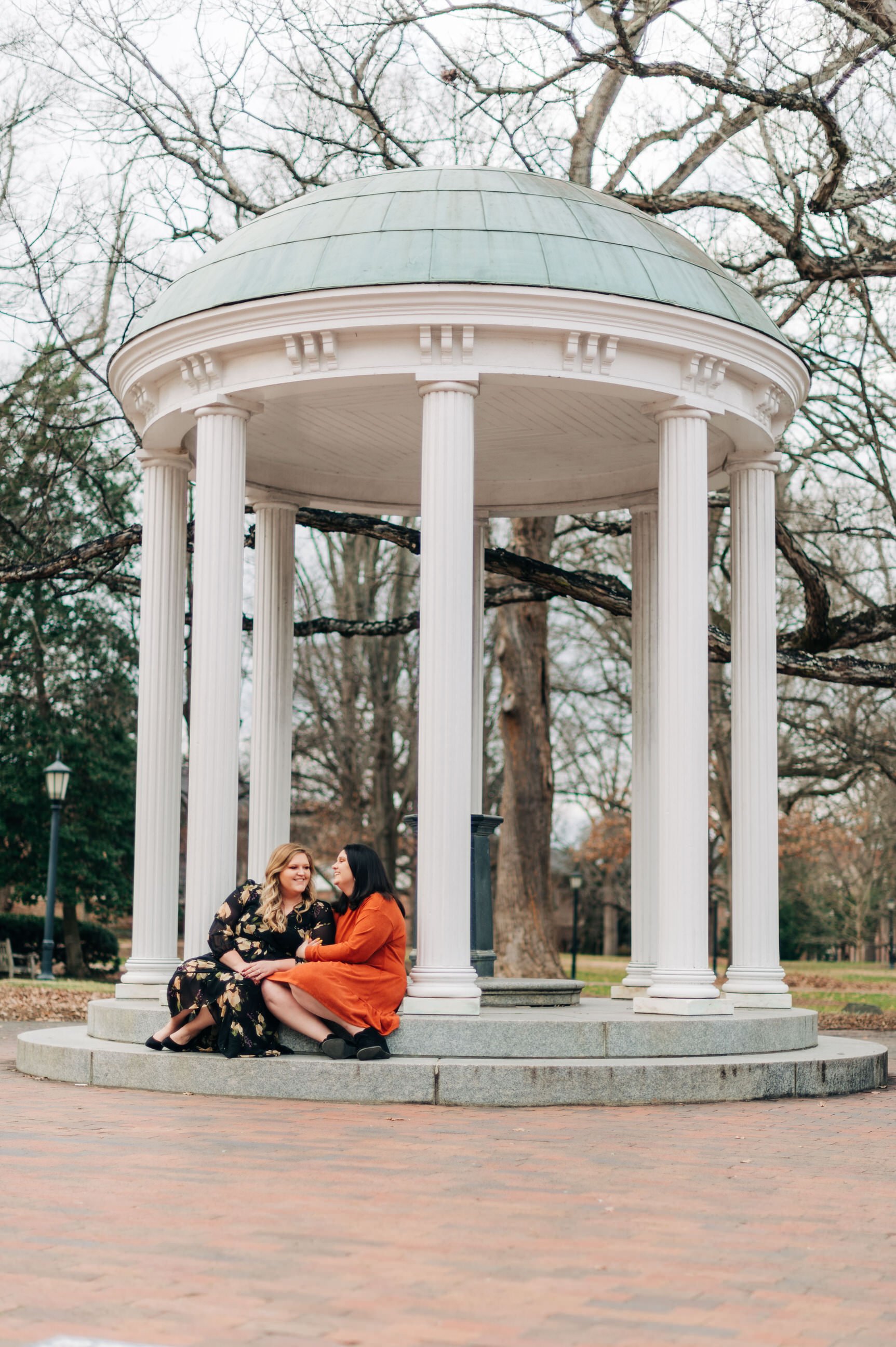  Couple sitting at the Old Well at Chapel Hill 