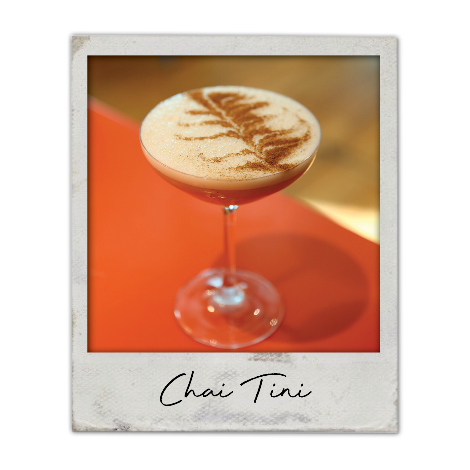 Chai Tini | The Breakfast Club USA, A creamy chai cocktail with cinnamon, served in a martini glass.