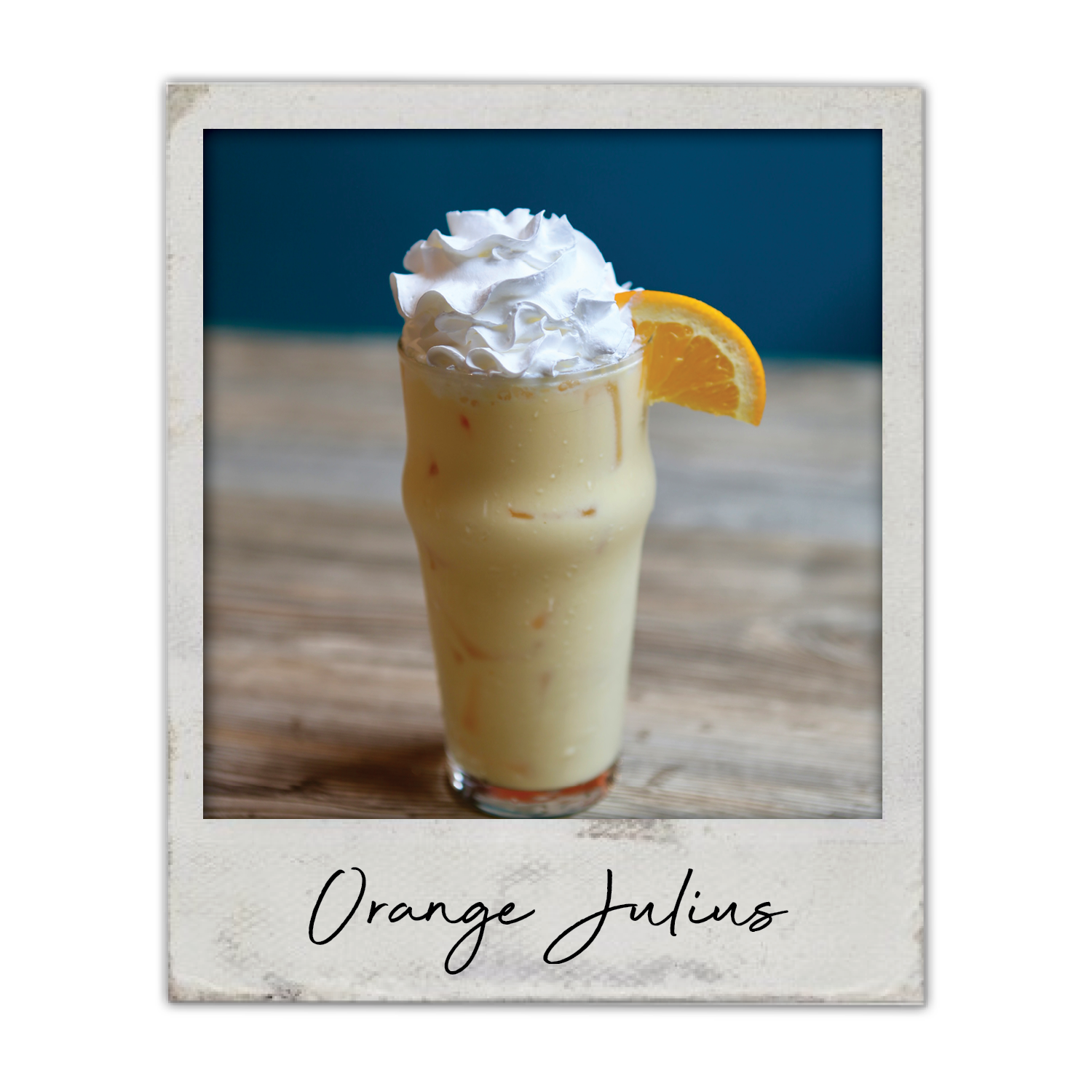 Orange Julius | The Breakfast Club USA, A creamy orange cocktail topped with whipped cream and served over ice.