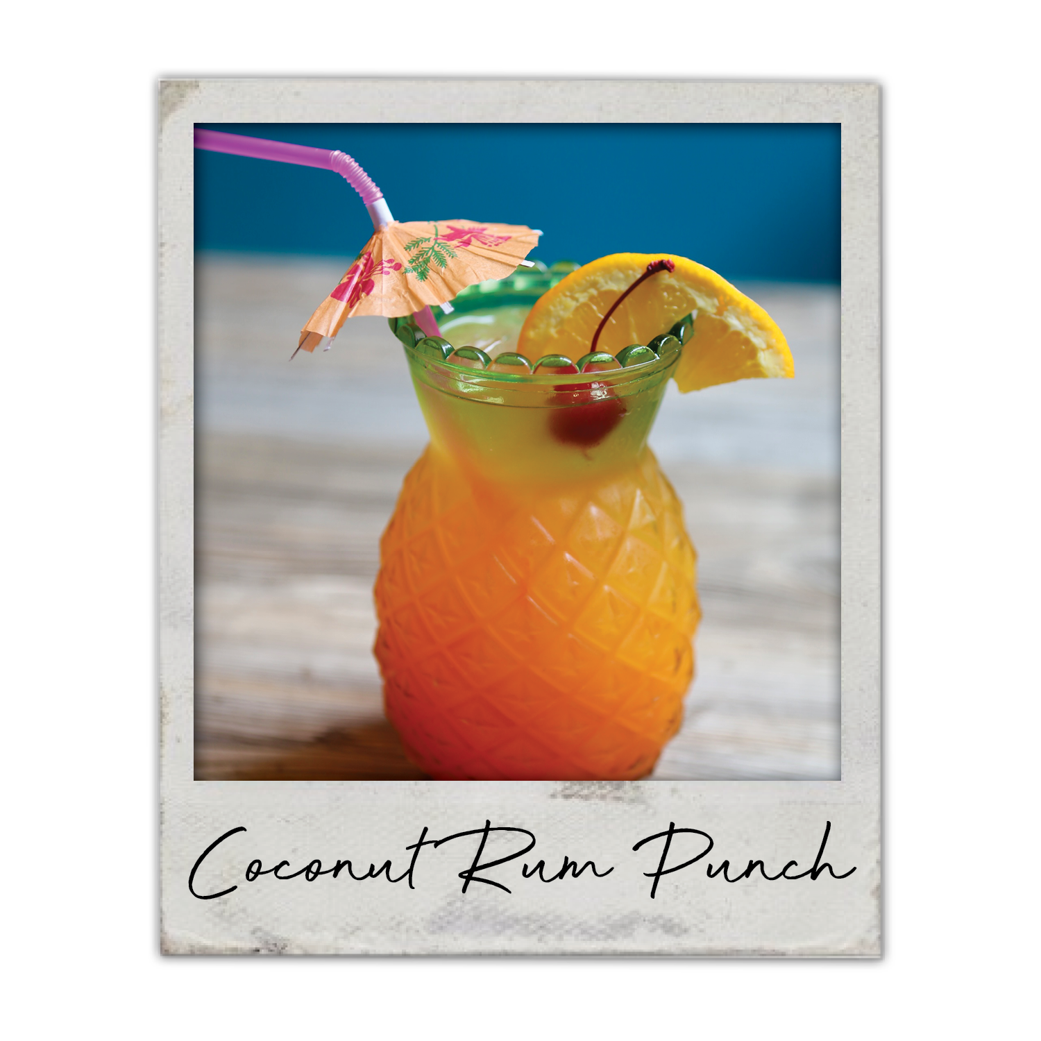 Coconut Rum Punch | The Breakfast Club USA in Central Iowa, A tropical rum punch with a fruit garnish and umbrella, served over ice.