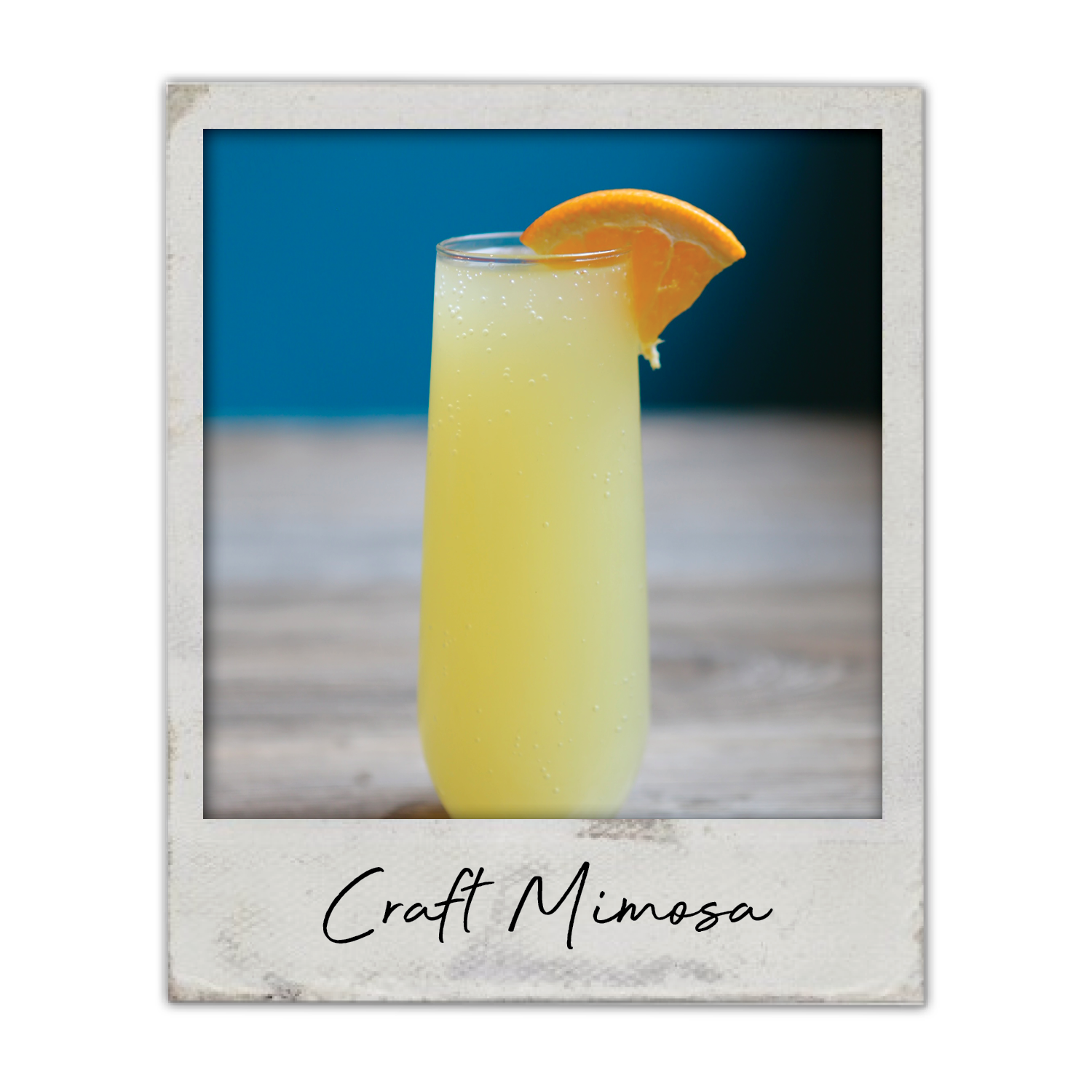Craft Mimosa | The Breakfast Club USA Iowa, A bright brunch mimosa served in a champagne flute with citrus garnish.
