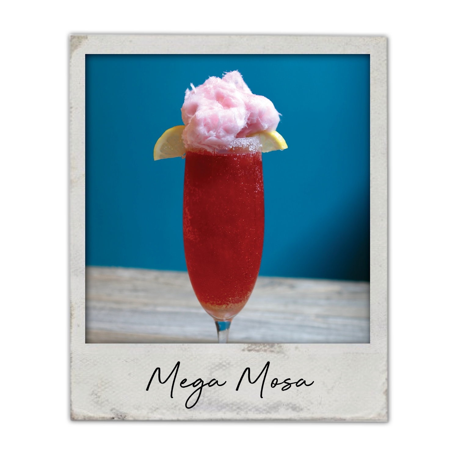 Mega Mosa | The Breakfast Club USA Iowa, A large flavored mimosa with fruit garnish and cotton candy topping.