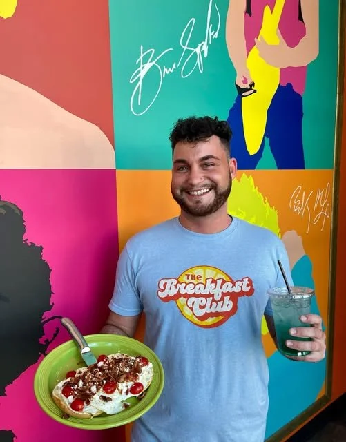 The Breakfast Club USA Brunch Restaurant in West Des Moines, Iowa Server Holding Breakfast and a Drink