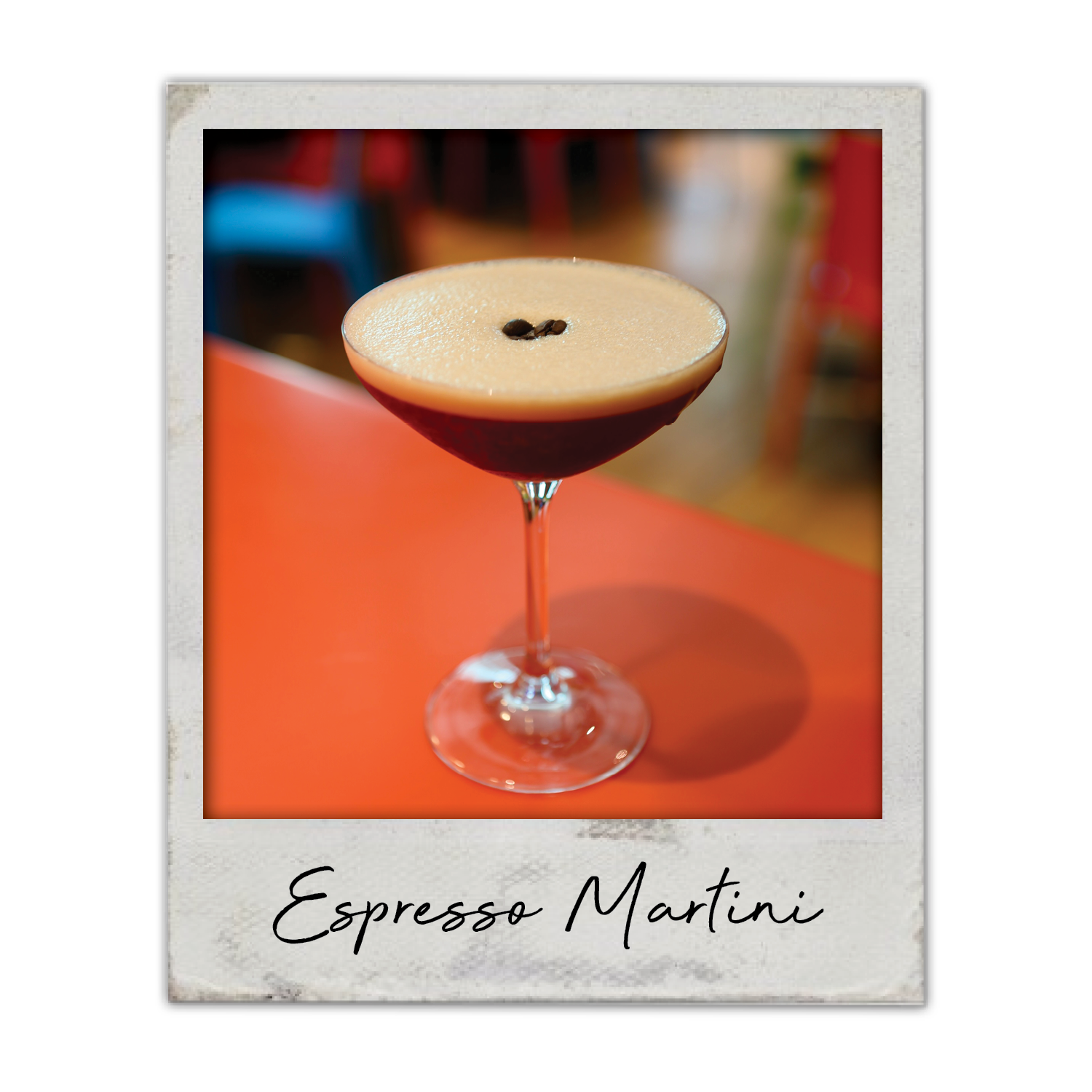 Espresso Martini | The Breakfast Club USA Iowa, A smooth espresso martini topped with espresso beans in a stemmed glass.
